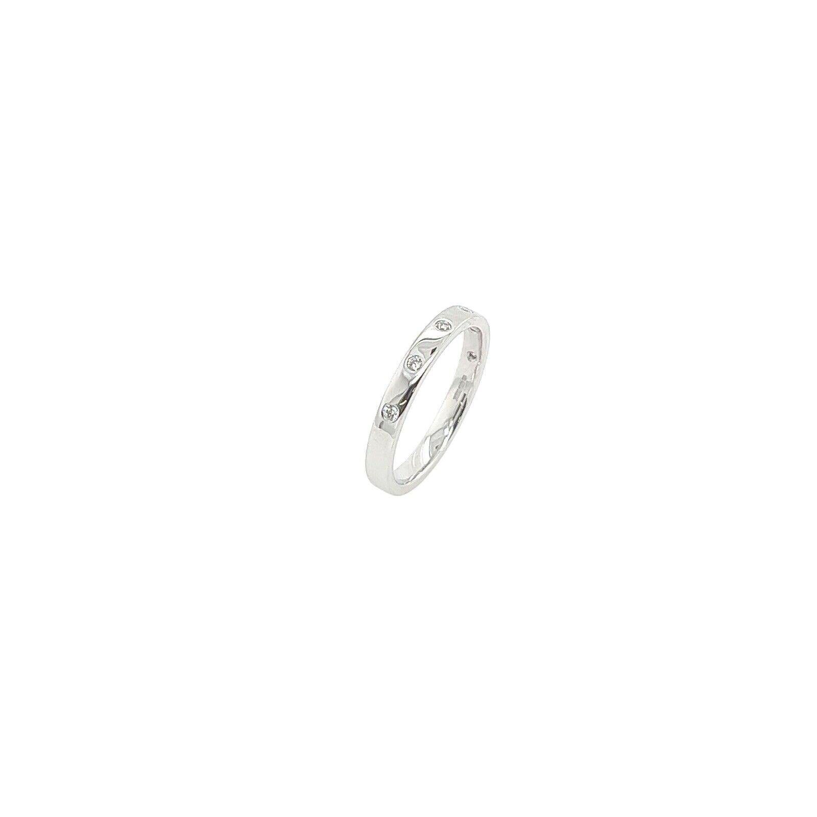 This 18ct White Gold Diamond wedding band is set with 6 round brilliant cut Diamonds. This ring is elegant and beautiful for wedding.

Additional Information:
Total Diamond Weight: 0.06ct 
Diamond Colour: G
Diamond Clarity: VS1
Width of Band: 2.50mm