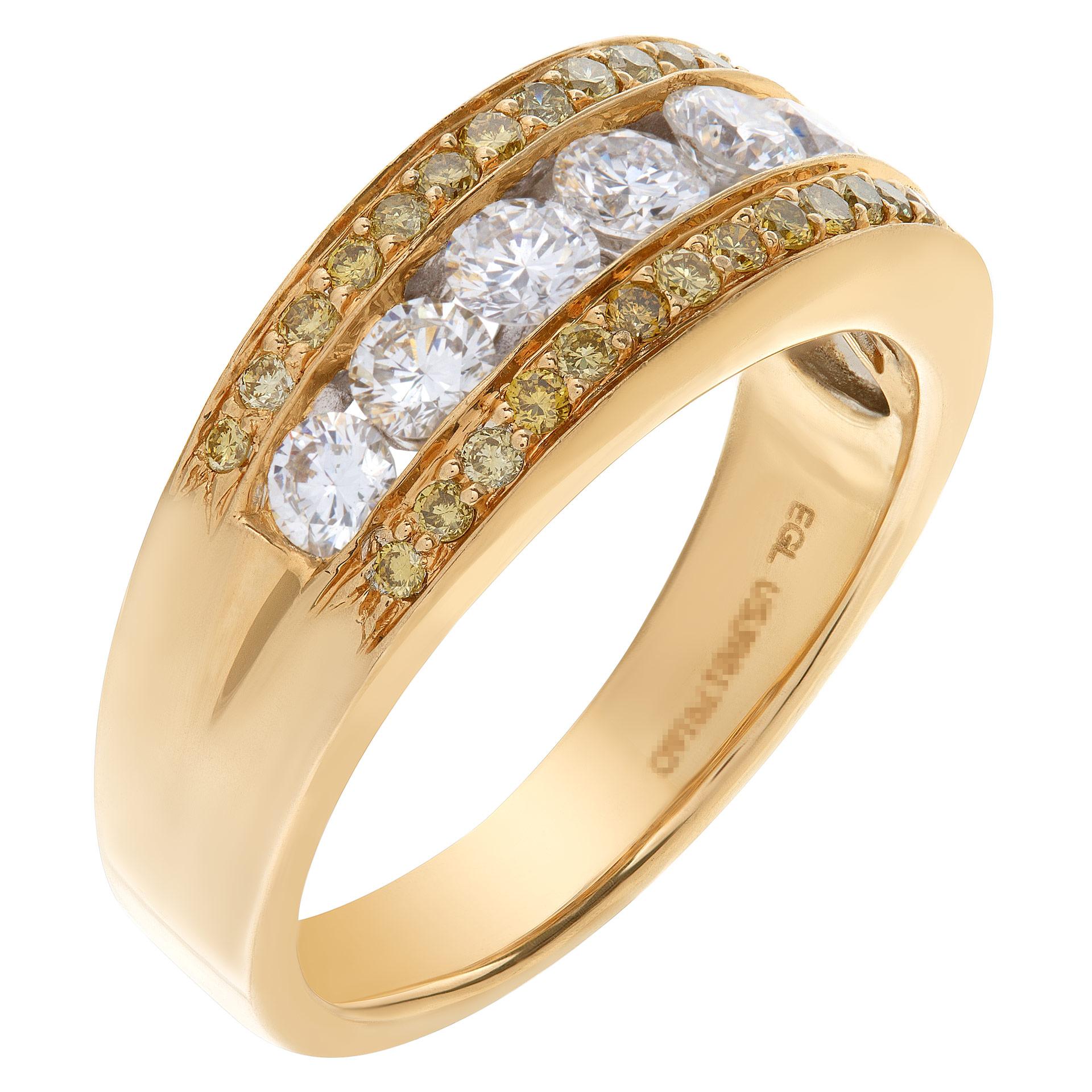 Exquisite diamond band ring with 7 full cut round brilliant diamonds set in 14K yellow gold, enhanced by irridiated yellow diamonds border on each side. Diamonds total approximately 1 carat, estimate G-H color, VS clarity. Size 7. Width at head: