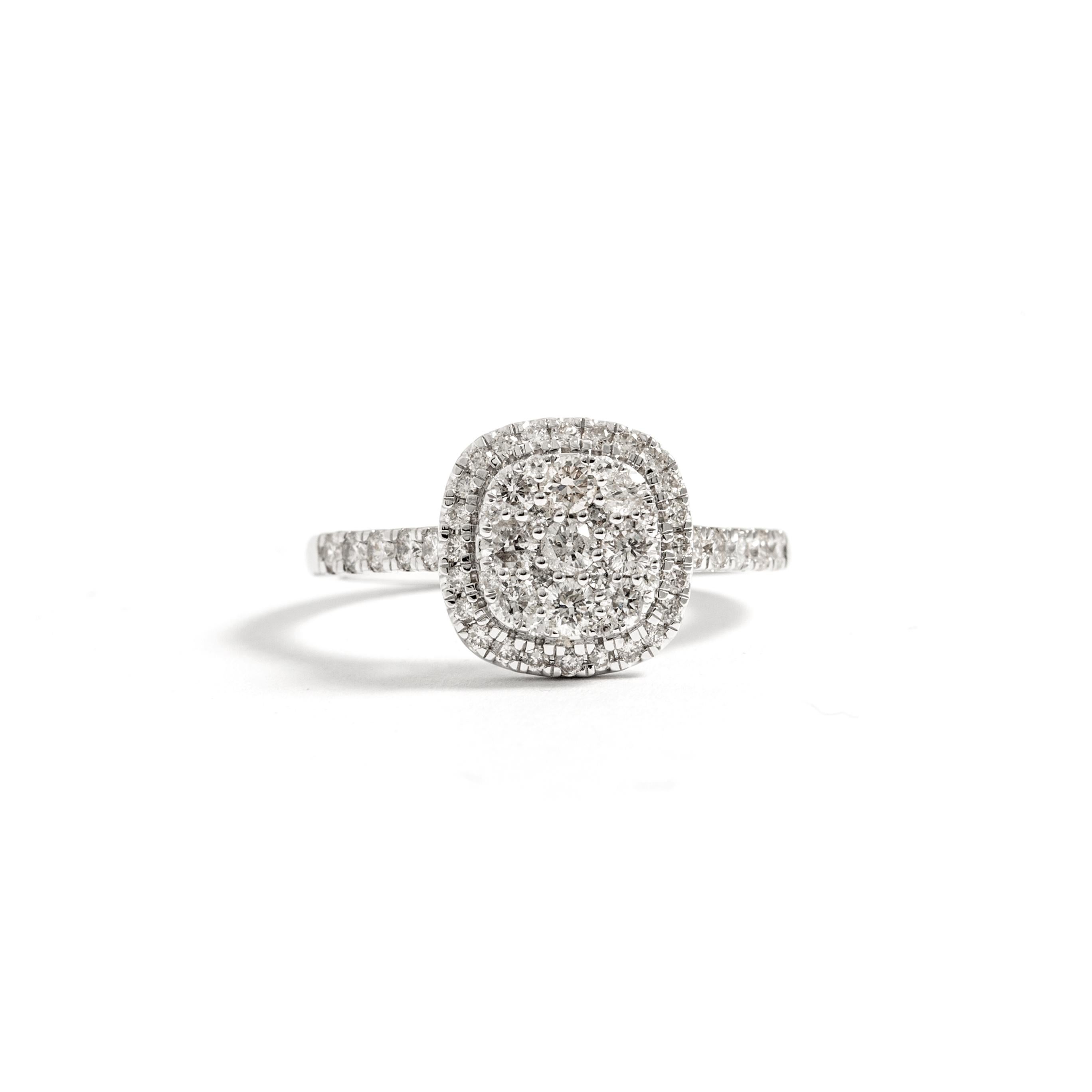 0.78 carat total natural diamonds G-H color, Si1 clarity on 18K white gold ring.
Size: 6.5 US.

