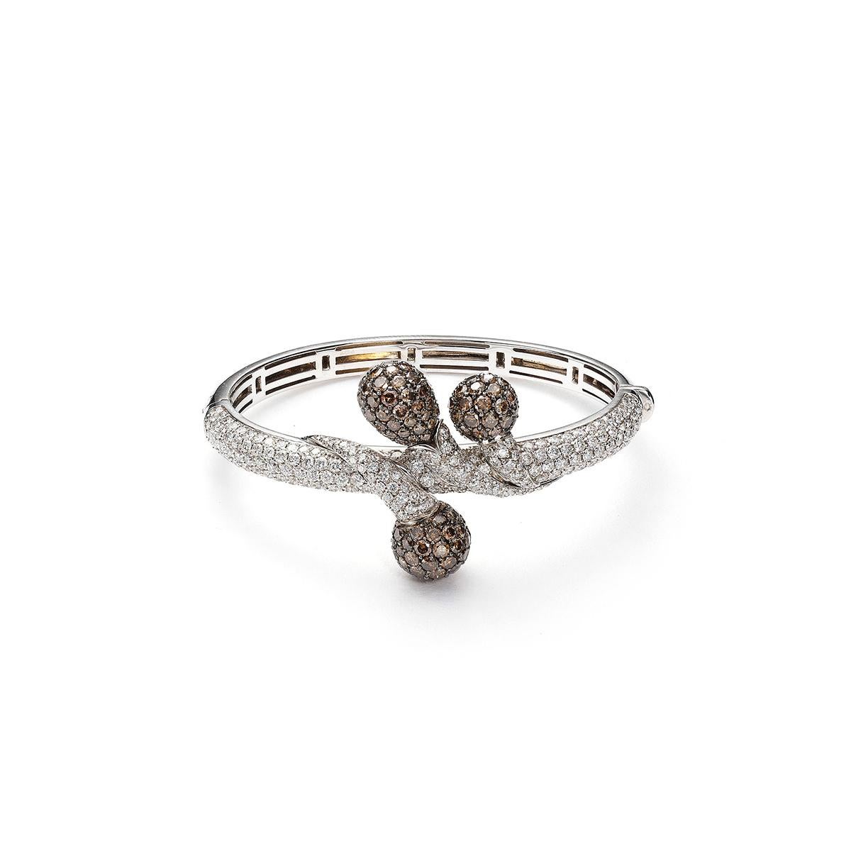 Bangle in 18kt white gold set with 237 diamonds 5.12 cts and 136 brown diamonds 5.77 cts