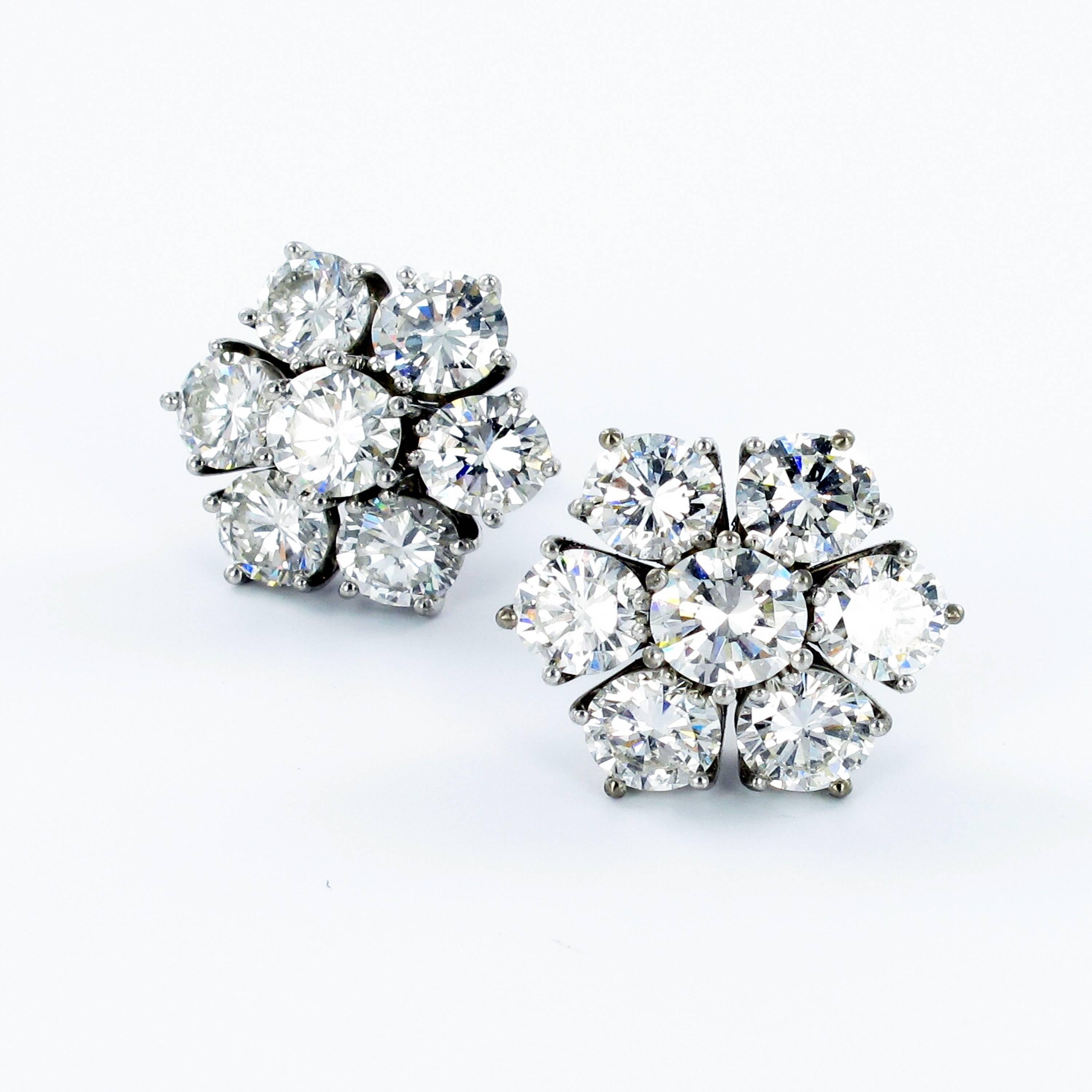 All time classic diamond cluster ear studs in white gold 750. Featuring 14 brilliant cut diamonds each carefully set in five prongs. Individual diamond weights just slightly under half a carat totaling approximate 6.74 ct. Fine F/G color and vs