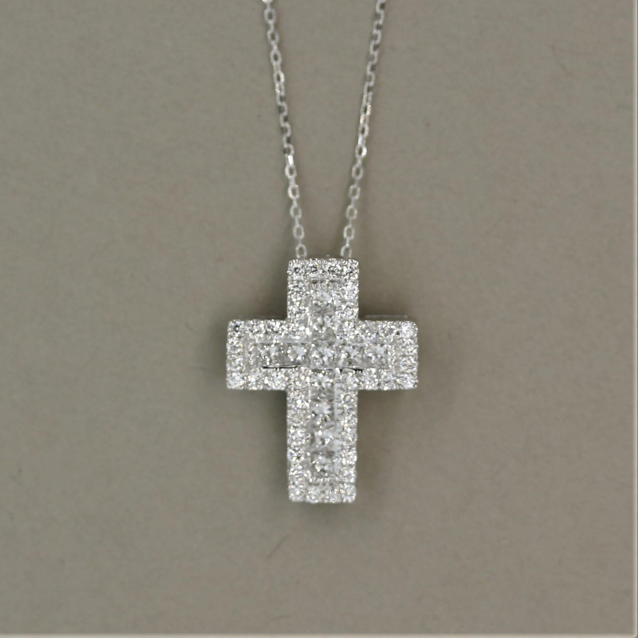 A diamond studded holy cross! It features an outer row of round brilliant cut diamonds along with an inner row of princess cut diamonds, weighing a total of 0.82 carats. The two different cuts of diamonds add a unique brilliance to the cross. Made