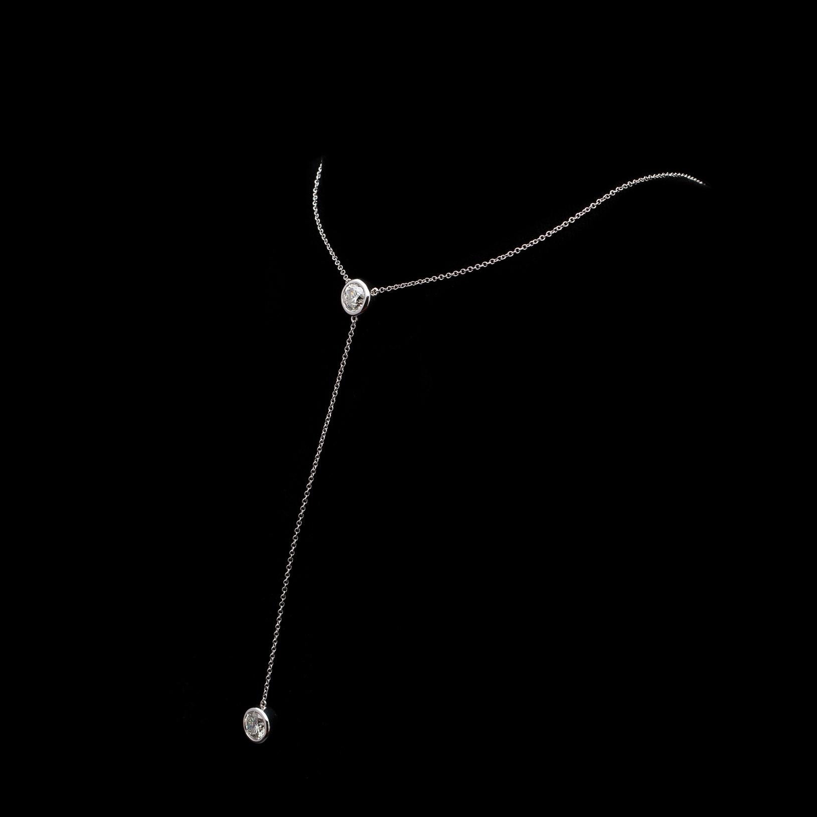 This delicate necklace is an understated statement piece! Set with two round brilliant-cut diamonds weighing in total 1.58cts, the fine 18k white gold chain will fall beautifully at the neckline, to upscale any outfit. Current length is 16