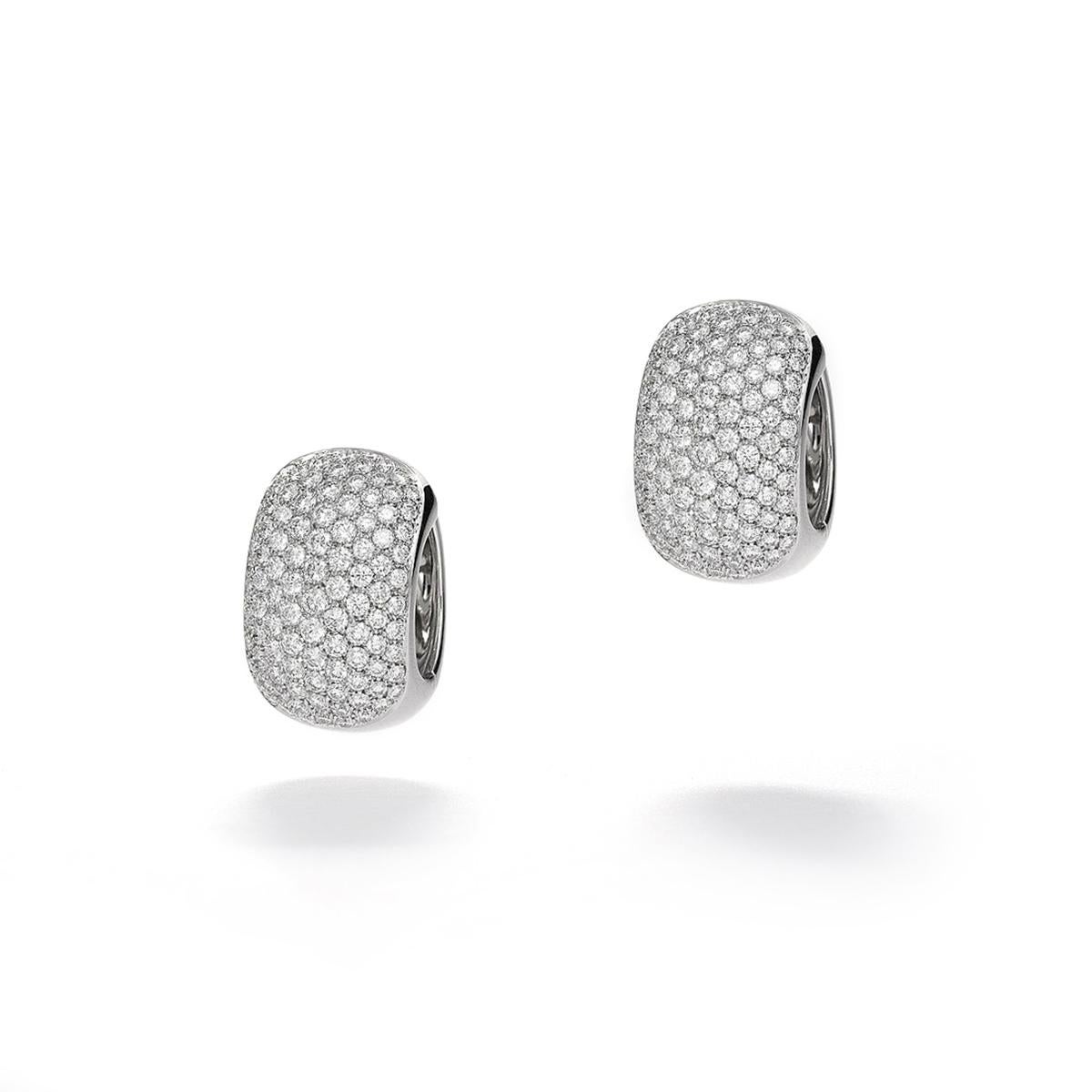 Allow yourself to be swept away by the sheer brilliance and elegance of our stunning Earrings in 18kt White Gold. These captivating earrings are a true testament to the beauty that can be achieved through exquisite craftsmanship and the sparkle of