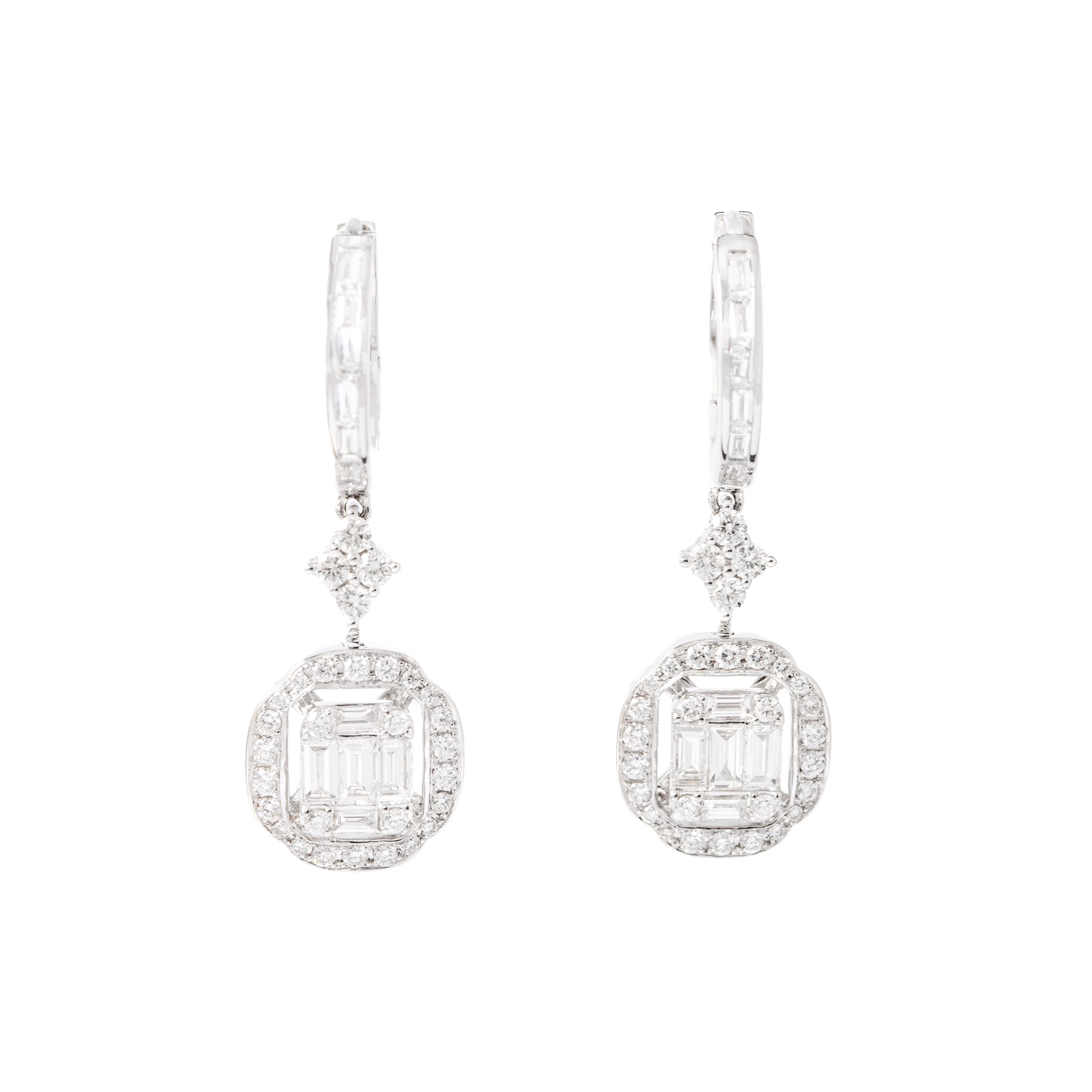 Earrings in 18kt white gold set with 60 diamonds 0.72 cts and 22 baguette cut diamonds 0.72 cts.

Length: 3.00 centimeters (1.18 inches).

Maximum Width: 1.00 centimeters (0.39 inches).

Total weight: 6.23 grams.