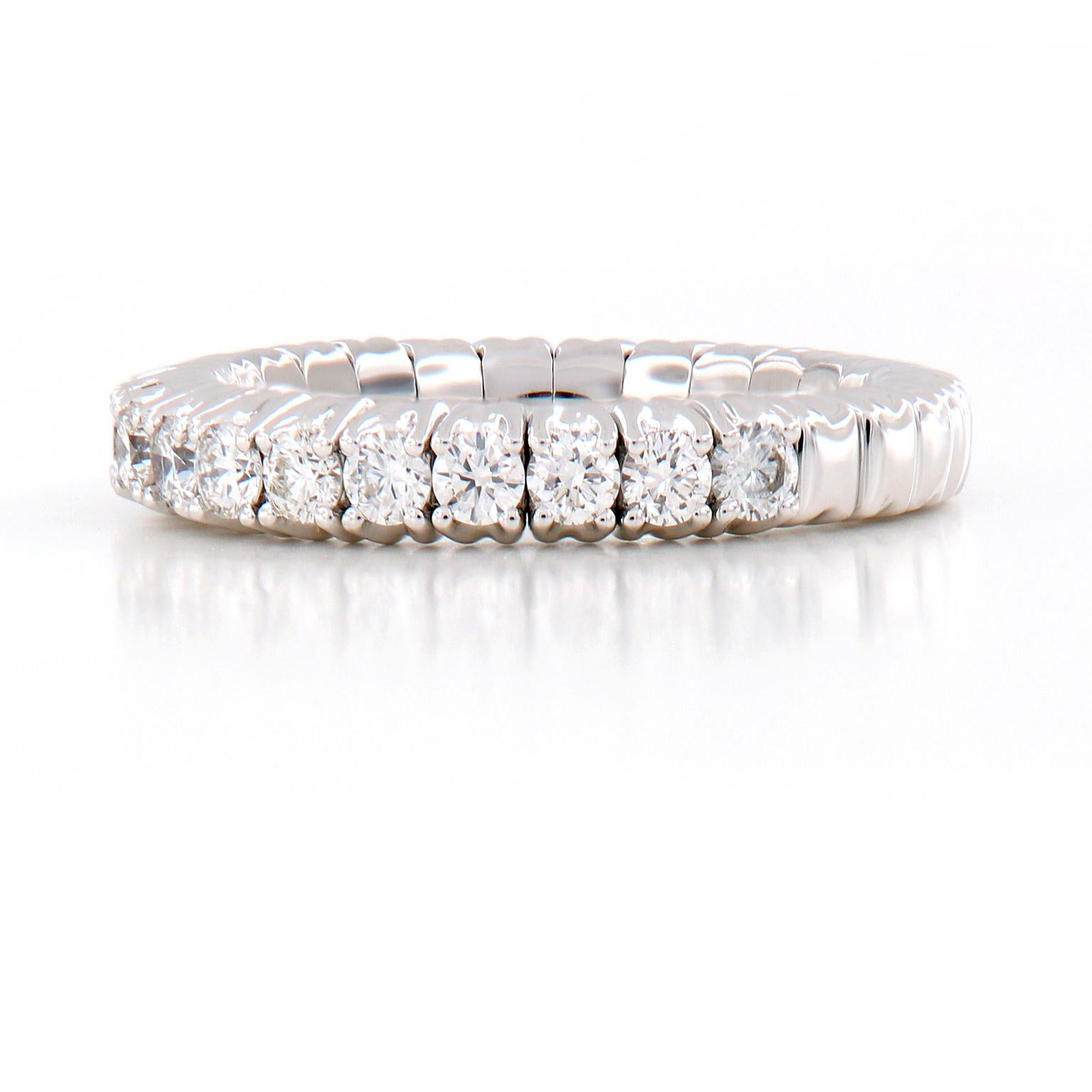 This beautiful stretchable diamond band ring is designed for comfort and perfectly fits one’s finger. It even fits those with larger knuckles! The ring is crafted in 18k white gold and feature 15 round brilliant cut diamonds. The band can stretch up