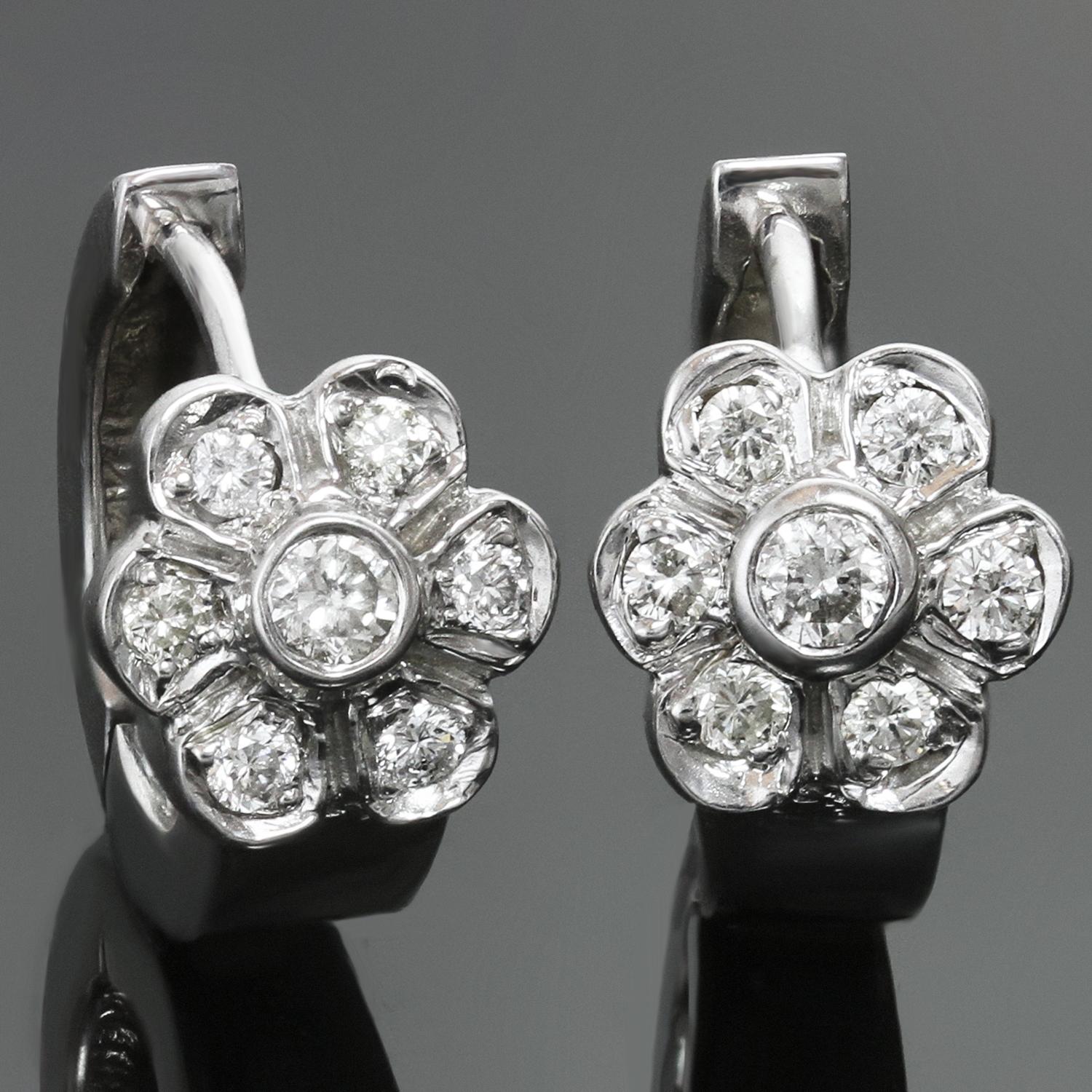 These elegant wrap earrings are crafted 14k white gold and feature a flower design set with brilliant-cut round diamonds of an estimated 0.38 carats. Made in United States circa 2000s. Measurements: 0.35