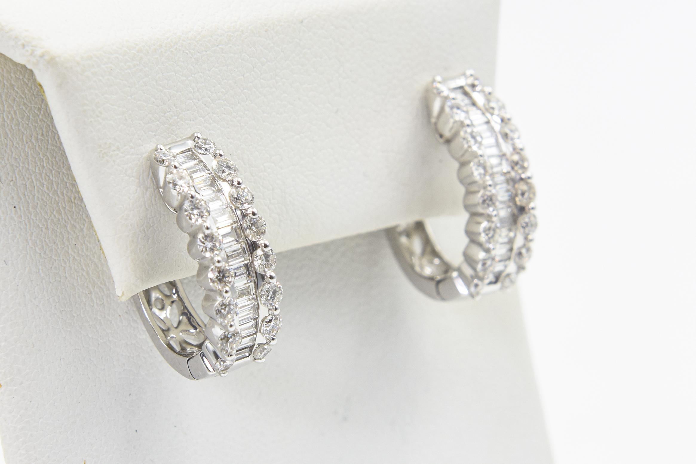 Beautifully made with white clean stones.  There 18k white good hoops contain 2.36 carats of diamonds. The back of the earrings has a elegant open work design so that you can wear them either way.

They have a lever back for pierced ears.

Marked