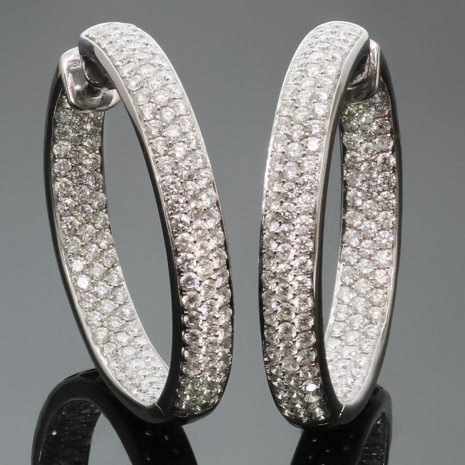 These magnificent hoop earrings featuring a sparkling inside out design are crafted in 18k white gold and set with brilliant-cut round G-H VS2-SI1 diamonds of an estimated 10.50 carats. Made in United States circa 2010s. Measurements: 0.27