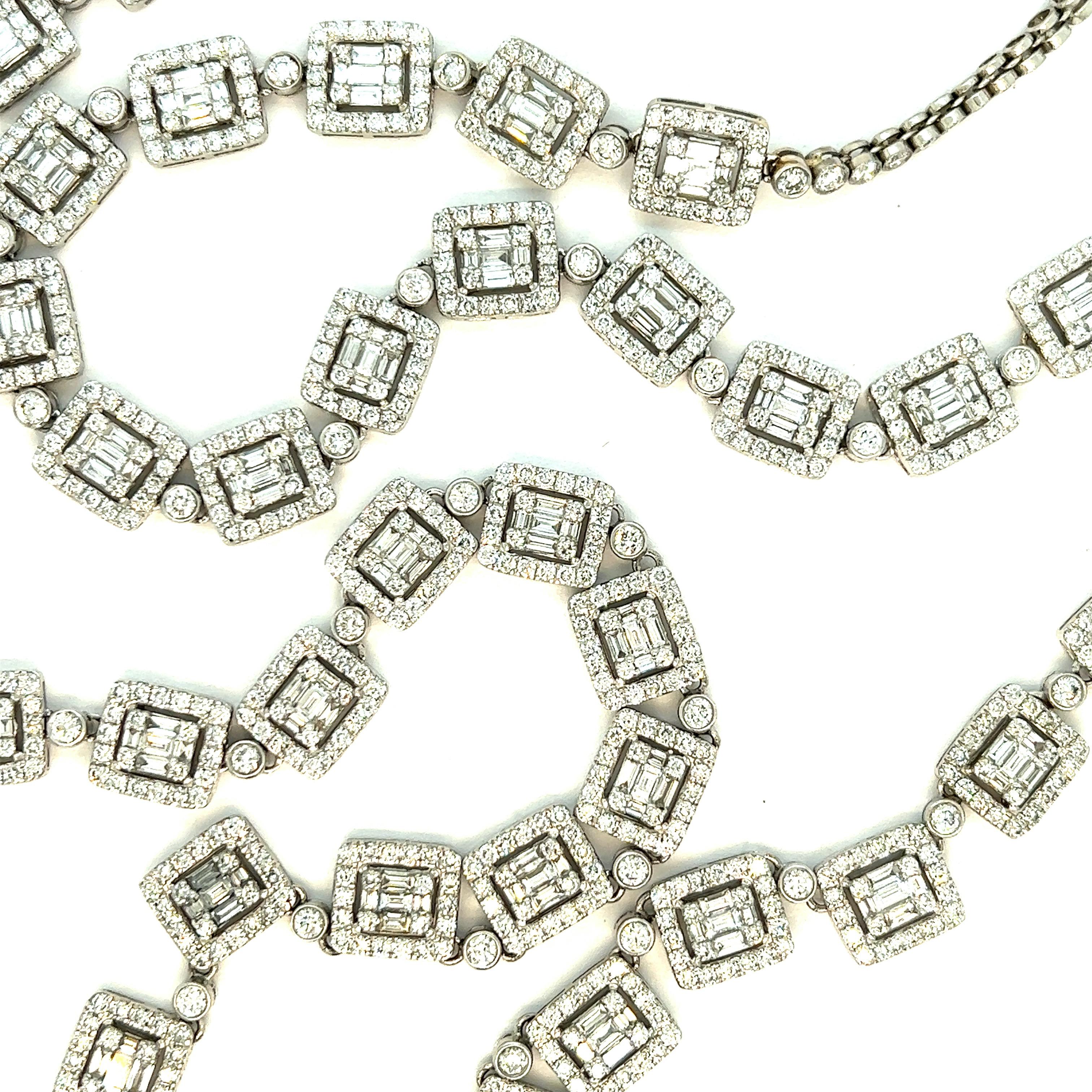 Diamond white gold long necklace

Round- and baguette-cut diamonds of approximately 32 carats, 18 karat white gold; chain marked 18K

Size: width 0.31 inch, length 31 inches
Total weight: 69.3 grams
