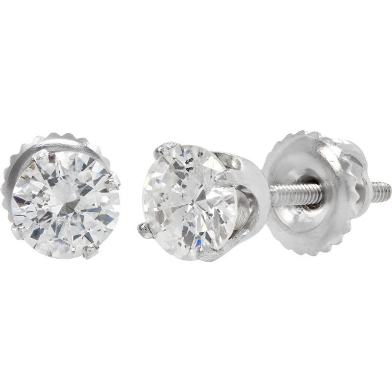 Diamond stud earrings in 14k white gold each diamond approximately 0.60 carat G-H color, SI-I clarity with screw backs. Total diamond weight approximately 1.20 carats.