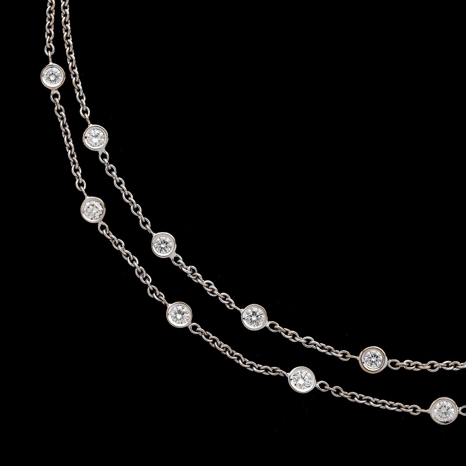 A delicate necklace with a bold look, this 18k white gold swag necklace is designed with two rows of 15 bezel-set round brilliant-cut diamonds totaling 1.50 carats, then finished with a double back chain. The necklace measures 16 inches, and weighs