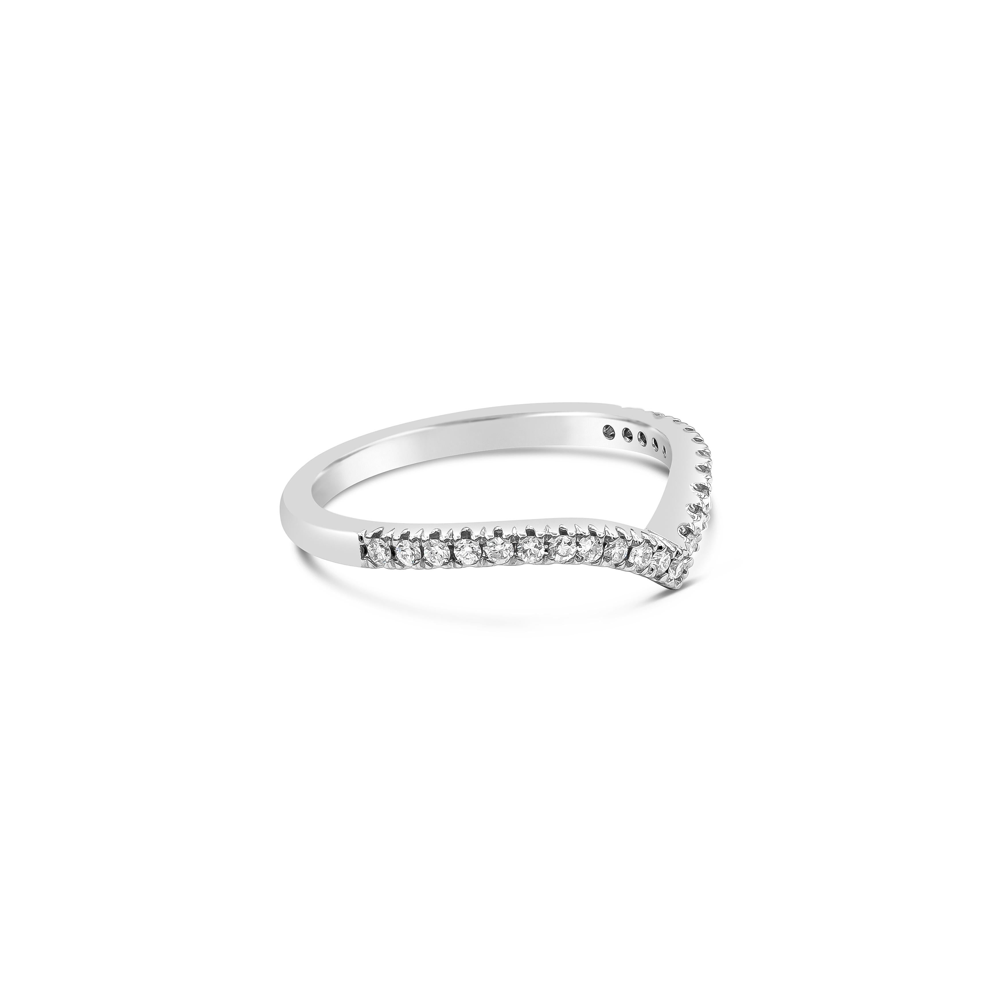A modern wedding band style that can stack with an engagement ring. Set with round brilliant diamonds weighing 0.22 carats total, along a V-shaped mounting. A perfect compliment for any shape engagement ring. Made with 18K White Gold, Size 6.5 US
