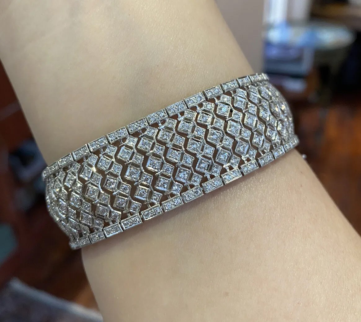 Diamond Wide Filigree Bracelet with 7.00 Carat Total Weight in Platinum

Wide Diamond Bracelet features Round Brilliant Diamonds in a Deco inspired pattern set in a wide Platinum setting with beautiful workmanship and Milgrain edges.

Total diamond