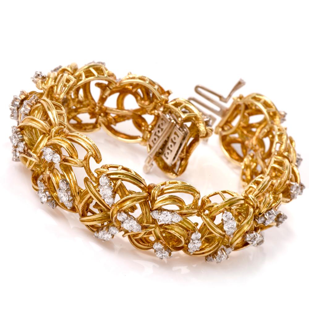 This chic bracelet is rendered in woven yellow gold wire to create an intricate crochet pattern. It weighs 100.6 grams and measures 6.75 inches around the inner wrist circumference and 23 mm wide. The aesthetically fascinating bracelet is