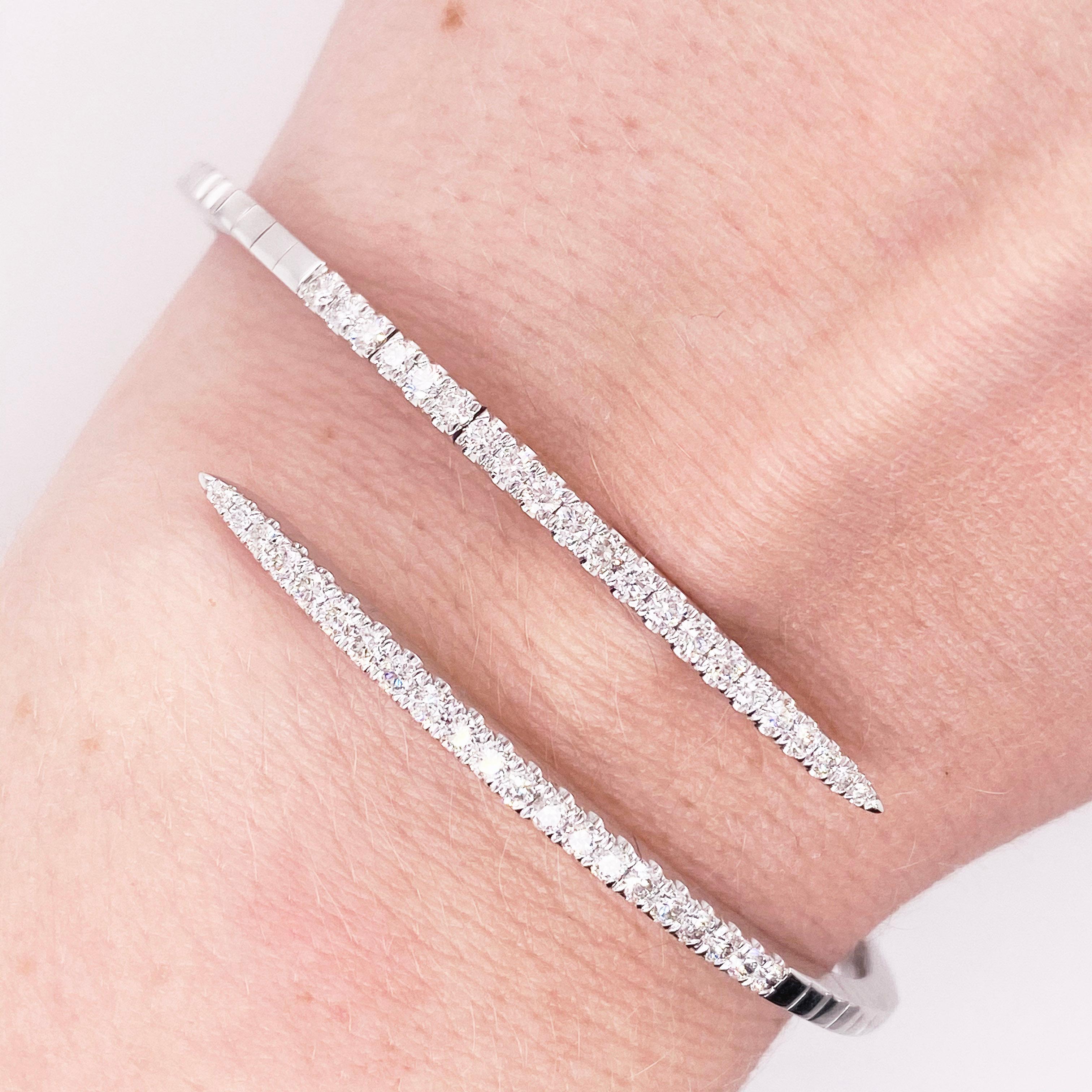 This Gold wrap bracelet is stunningly beautiful polished white gold split bypass bangle bracelet dripping with round diamonds provides a look that is very classic and modern at the same time! This bracelet is very fashionable and can add a touch of
