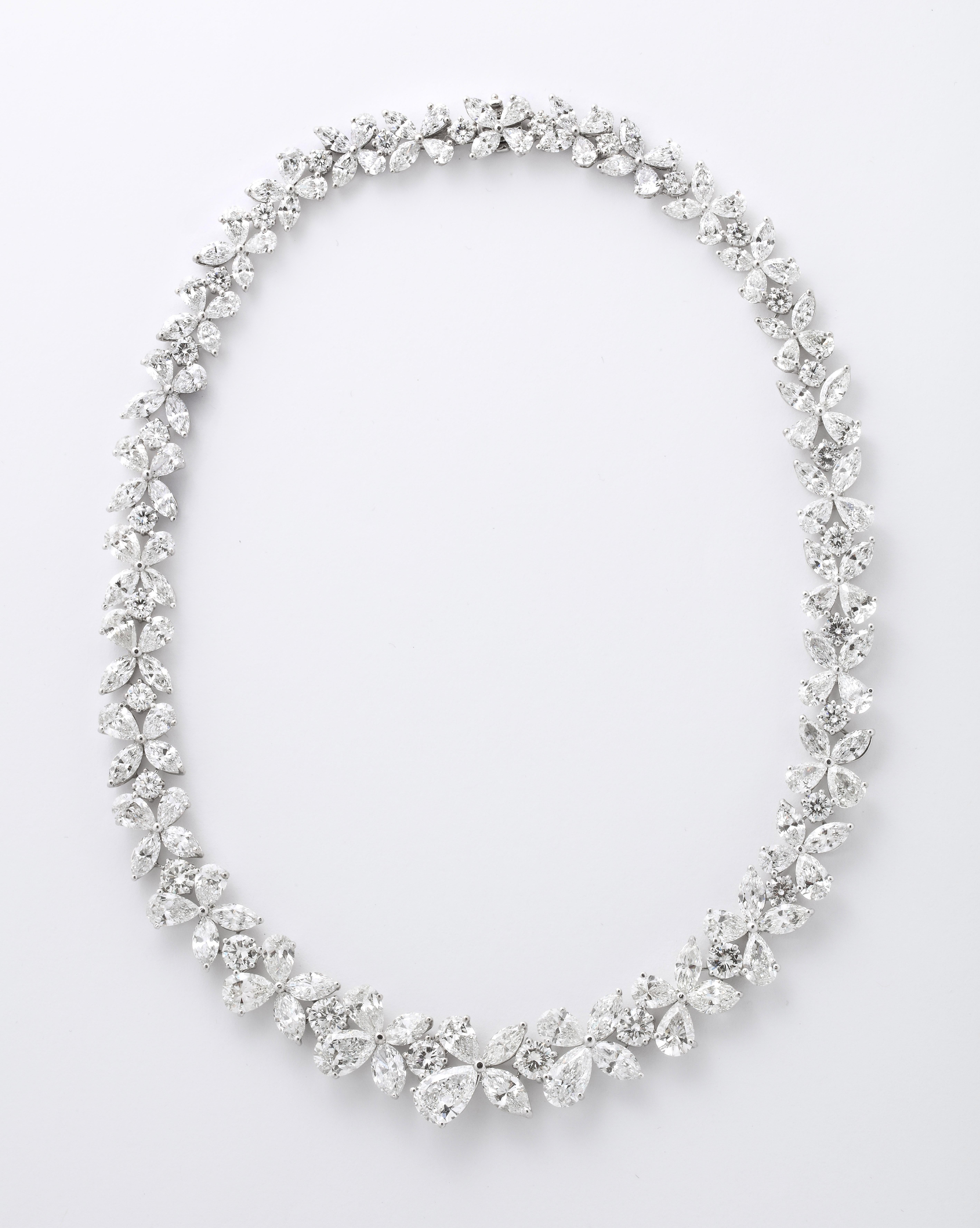 
An important diamond wreath necklace. 

76.82 carats of white pear, marquise and round brilliant cut diamonds set in platinum. 

An incredible necklace -- full of sparkle -- featuring diamonds from 1 to over 2 carats in the center.

The center link