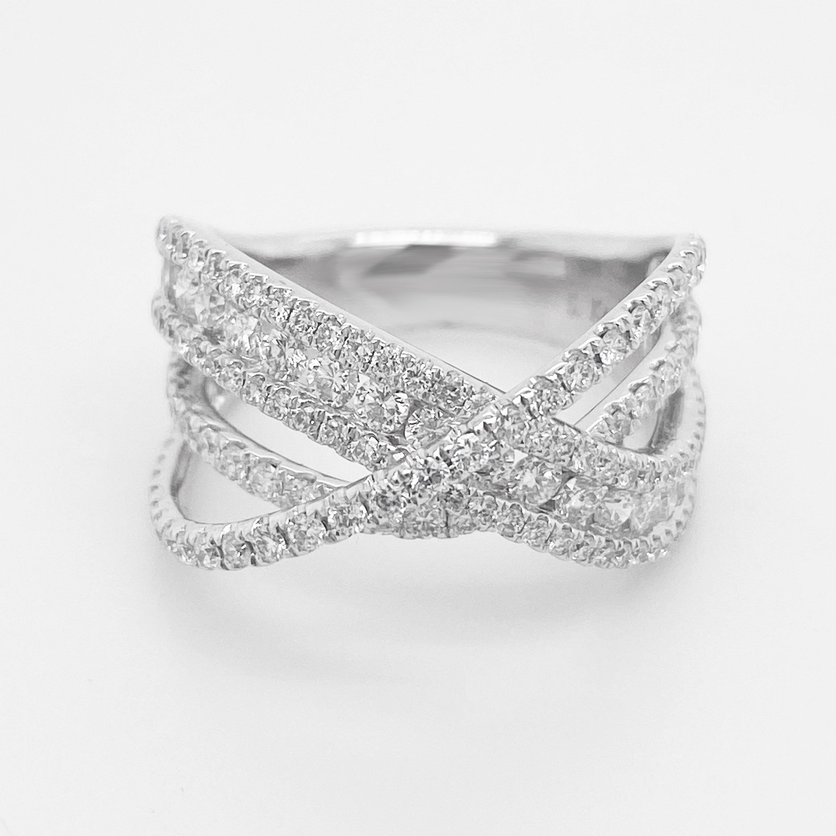 This X Diamond Ring is so Delightful!  The ribbons of diamonds and gold have three different levels that go diagonal across your finger.  The round brilliant cut diamonds sparkle from every direction!  The diamonds make the ribbon and there is very