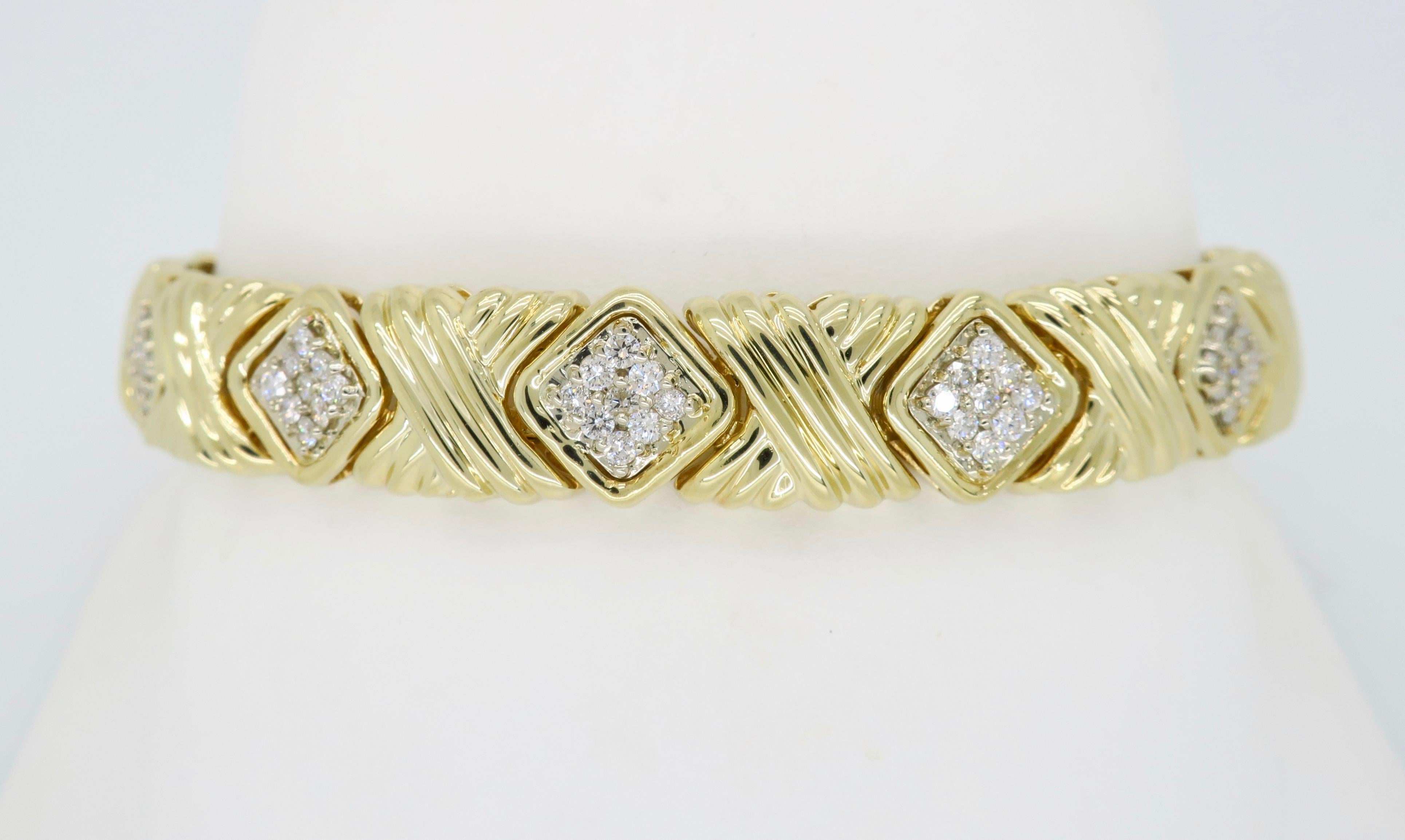 Unique “X” style diamond link bracelet crafted in 14k yellow gold.

Diamond Carat Weight: Approximately 1.05CTW
Diamond Cut: Round Brilliant Cut 
Color: Average G-J
Clarity: Average SI
Metal: 14K Yellow Gold
Marked/Tested: Stamped  “14K