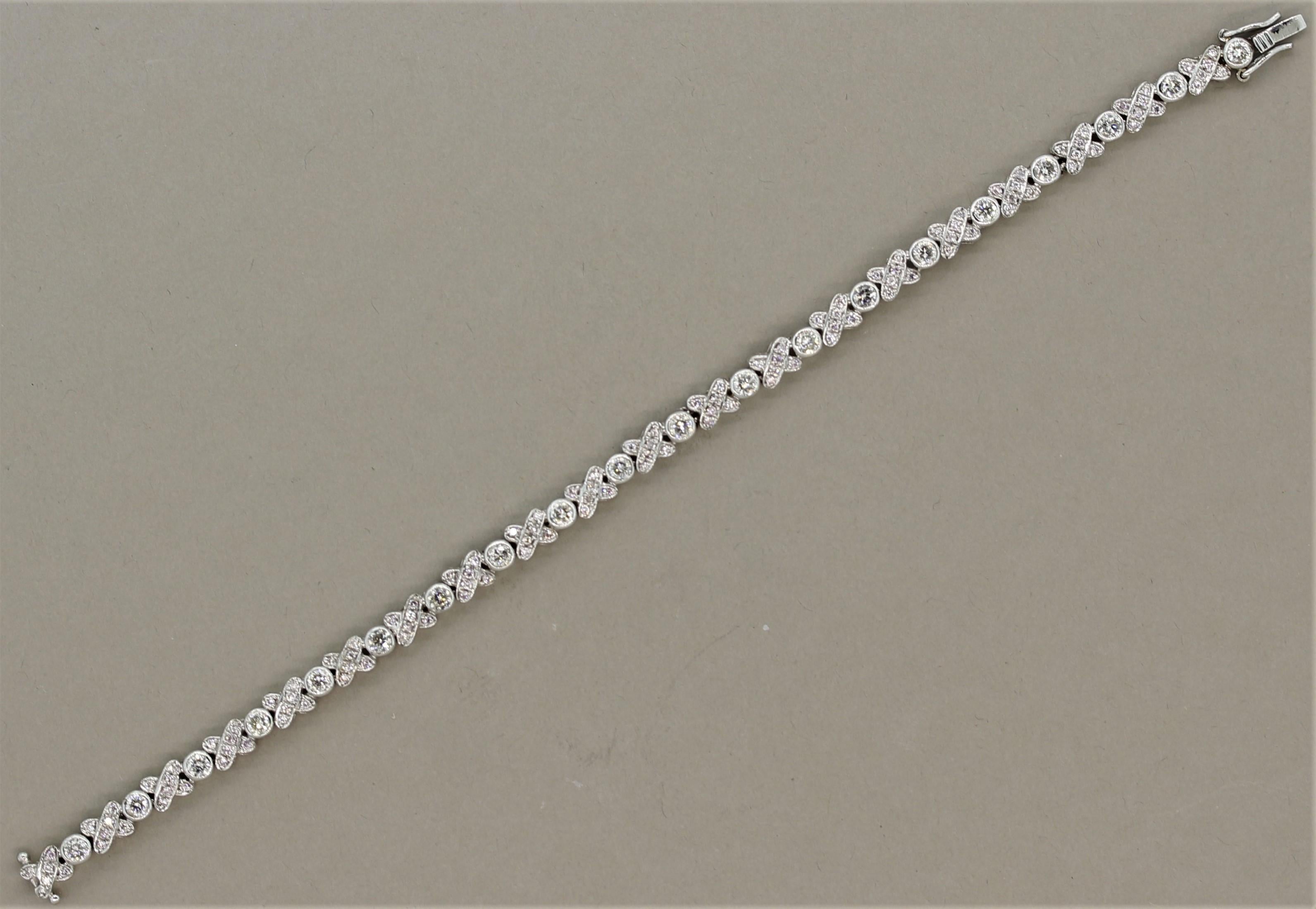 A sweet diamond bracelet in a stylish “XO” design. It features 4.20 carats of round brilliant cut diamonds set across the bracelet creating X and O lettering. The X are set with smaller diamonds while the O is a larger single stone. Made in 14k