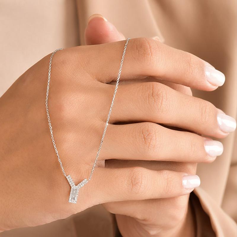 Personalized Valentine's Day Gifts for LOVE
This Beautiful Diamond Letter Pendant Is Entirely Handcrafted In 14K White Gold. 
The Letter Y Pendant Is Garlanded With Channel-Set Baguette-Cut Diamonds And Prong Set Brilliant Round Diamonds Weighing