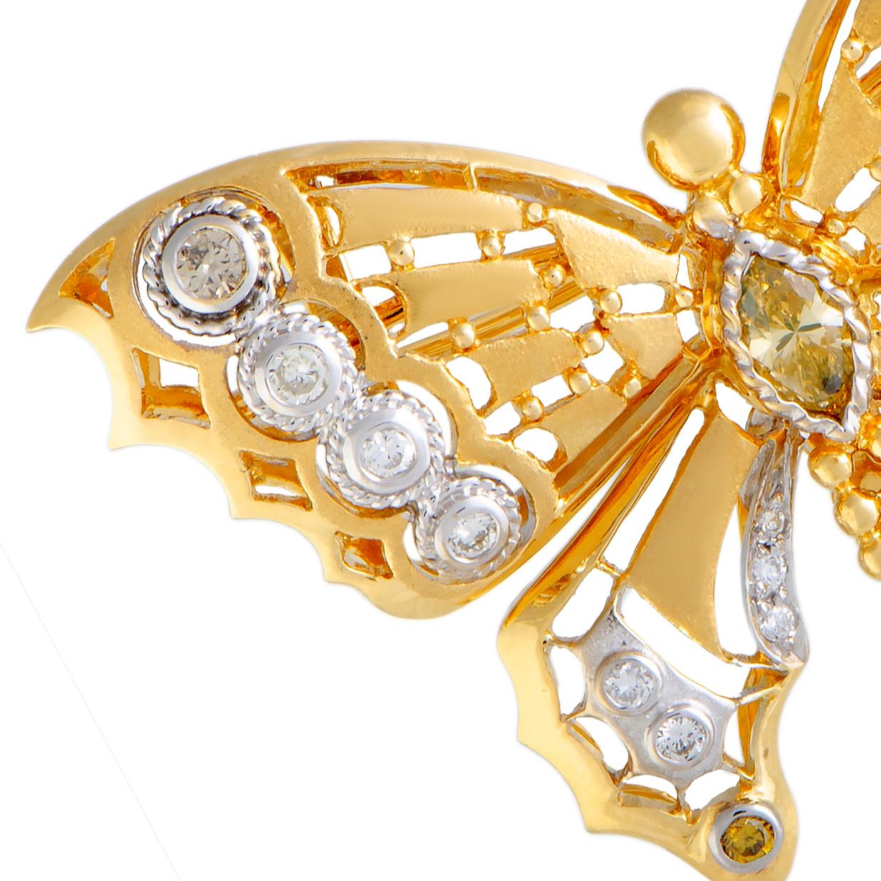 The eye-catching radiance of 18K yellow gold is attractively accentuated by the elegant gleam of 18K white gold in this spectacular brooch that takes the form of a graceful butterfly. The brooch is given a delightful touch of scintillating