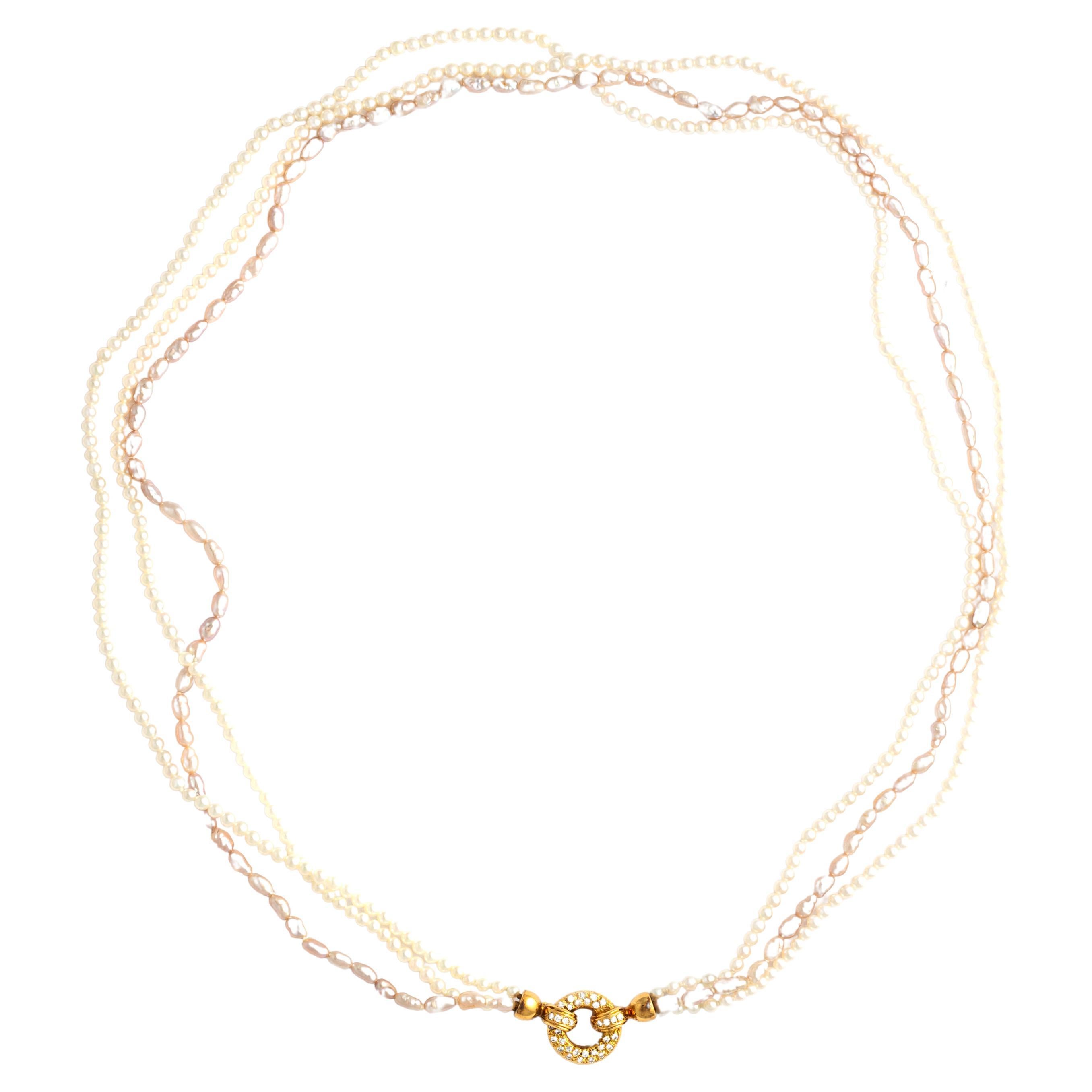 Cultured Pearl Necklace holding a Diamond Yellow Gold 18K clasp.The timeless allure of cultured pearls meets the brilliance of diamonds in a harmonious union of elegance and luxury.

The necklace showcases lustrous cultured pearls, each one