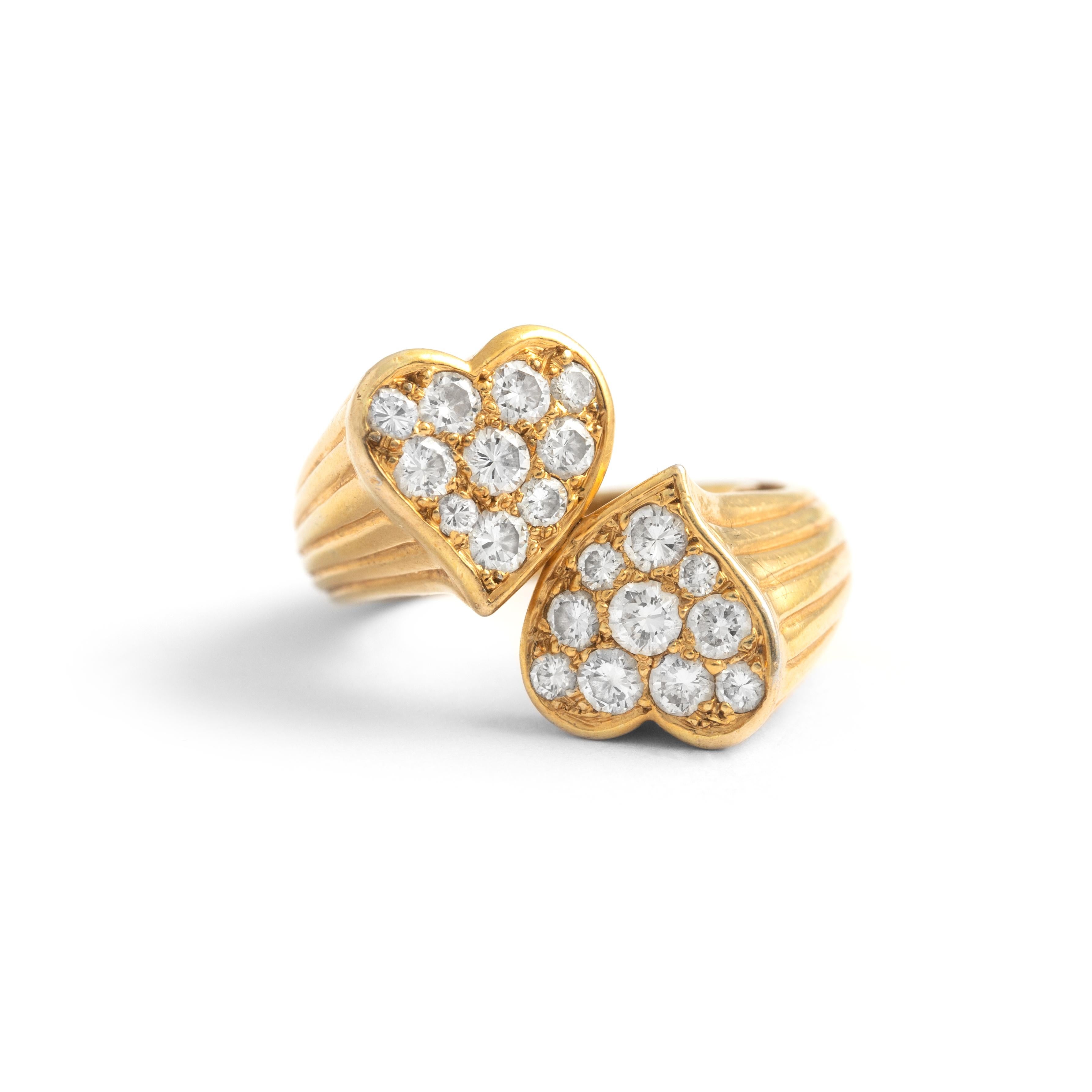 Diamond Yellow Gold 18K Two Hearts Crossover Ring.
Height Heart motif: approx. 1.60 centimeters.

Size: 47 / 4.5 US.

Weight: 10.17 grams.



