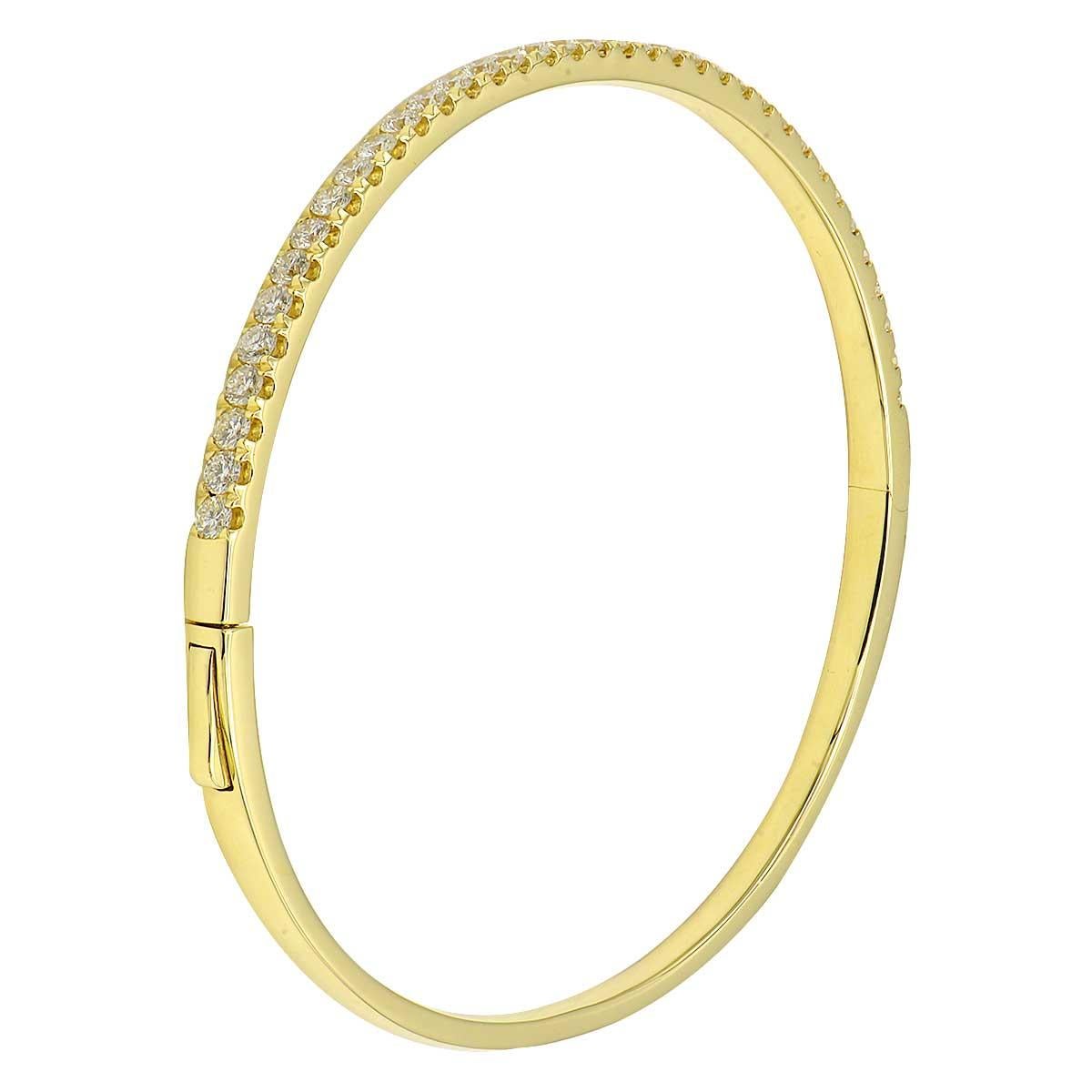 This simple but gorgeous bracelet is perfect for everywhere and everyone. It can be stacked with others or worn alone for a classic look. These 45 round VS2, G color diamonds totaling 0.82 carats are set in 11.9 grams of 18 karat yellow gold. This