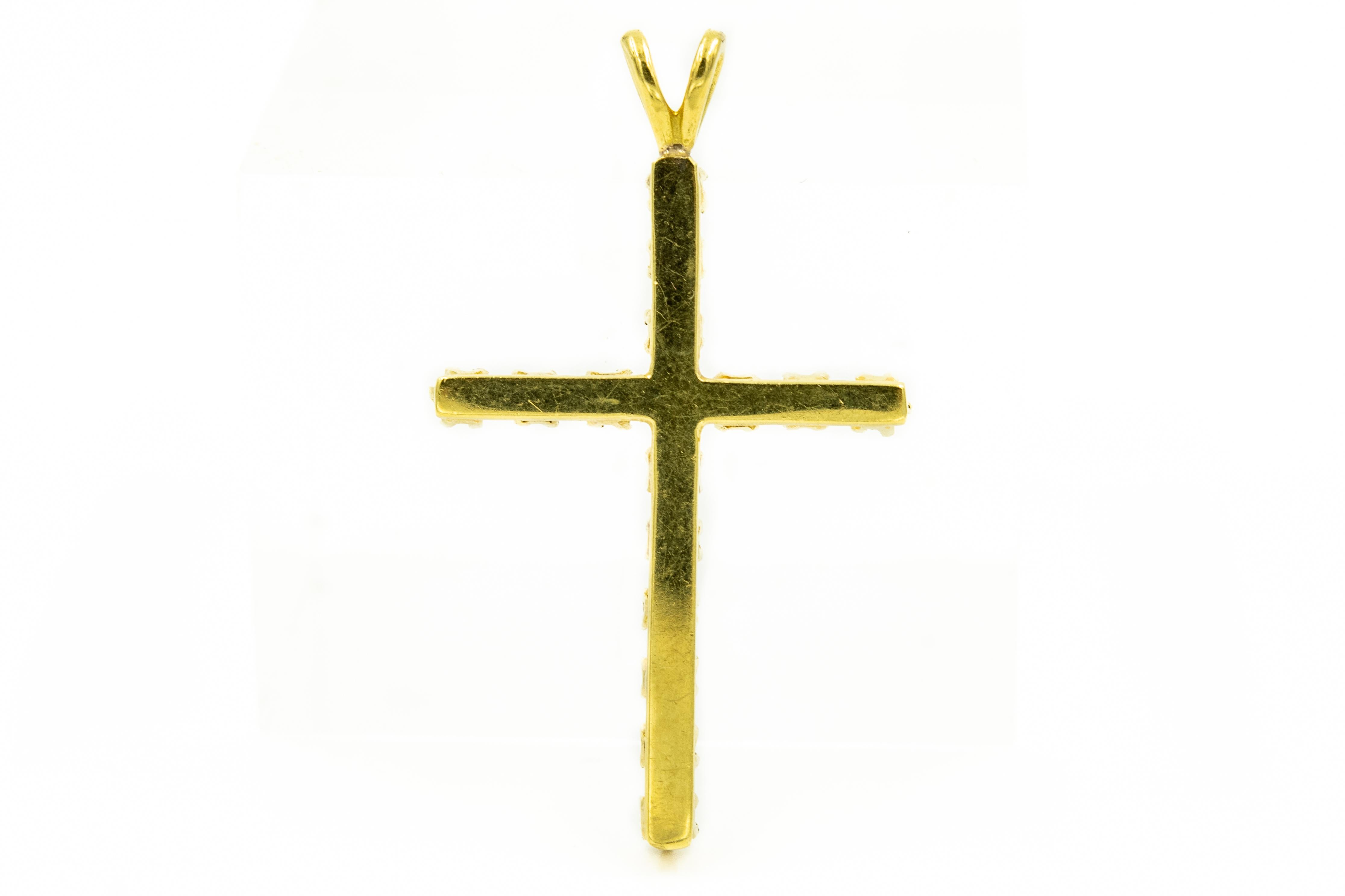 Elegant classic 14k yellow gold diamond cross featuring 16 nice quality diamonds weighting approximately .05 carats each for a total weight of .80 carats in diamonds.  The cross has a rabbit ear on top for you to put your chain through the hole for