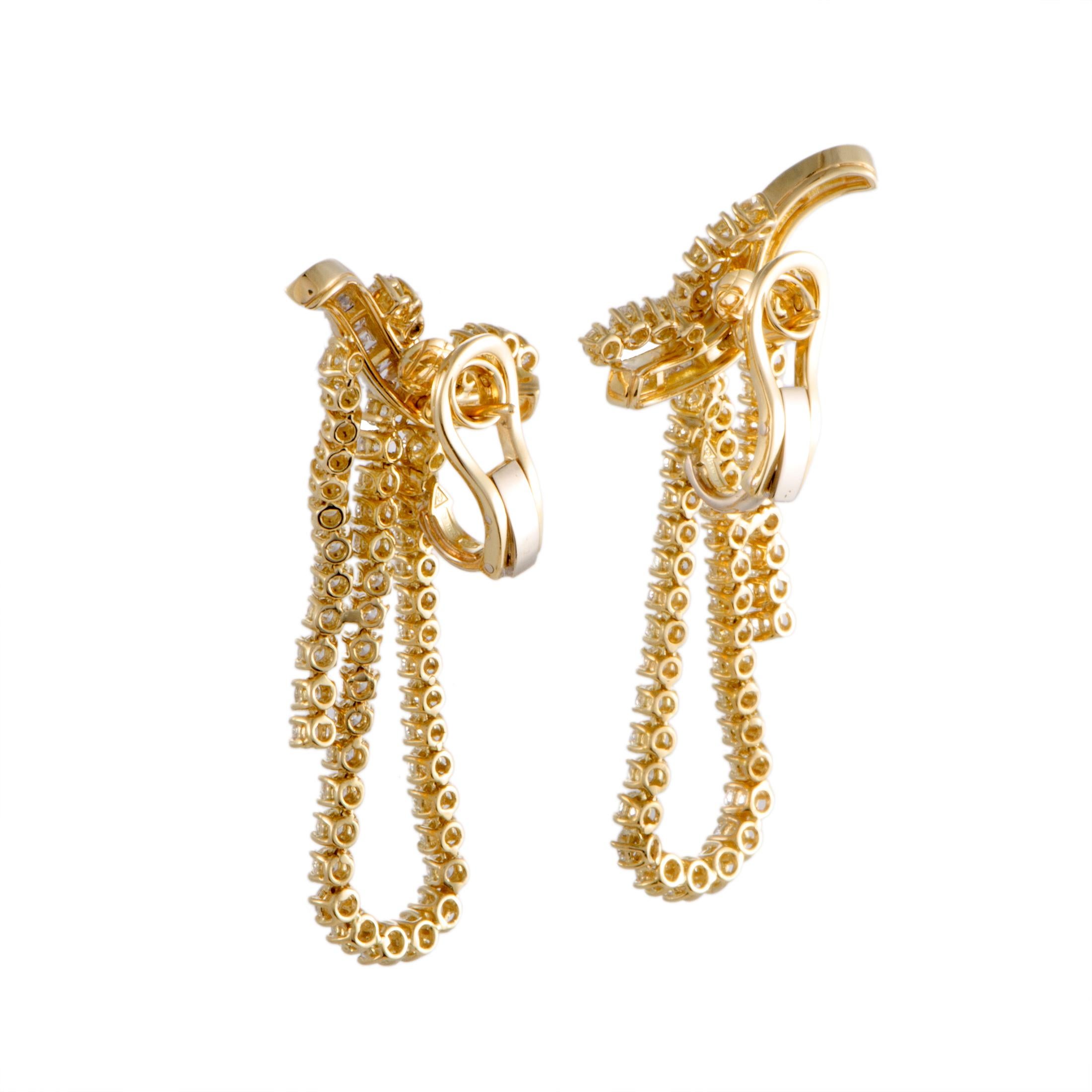 An exceptionally elegant design is marvelously presented in ever-luxurious 18K yellow gold in this exquisite pair of earrings that offers a splendidly sophisticated appearance. The earrings are lavishly decorated with dazzling diamonds that amount