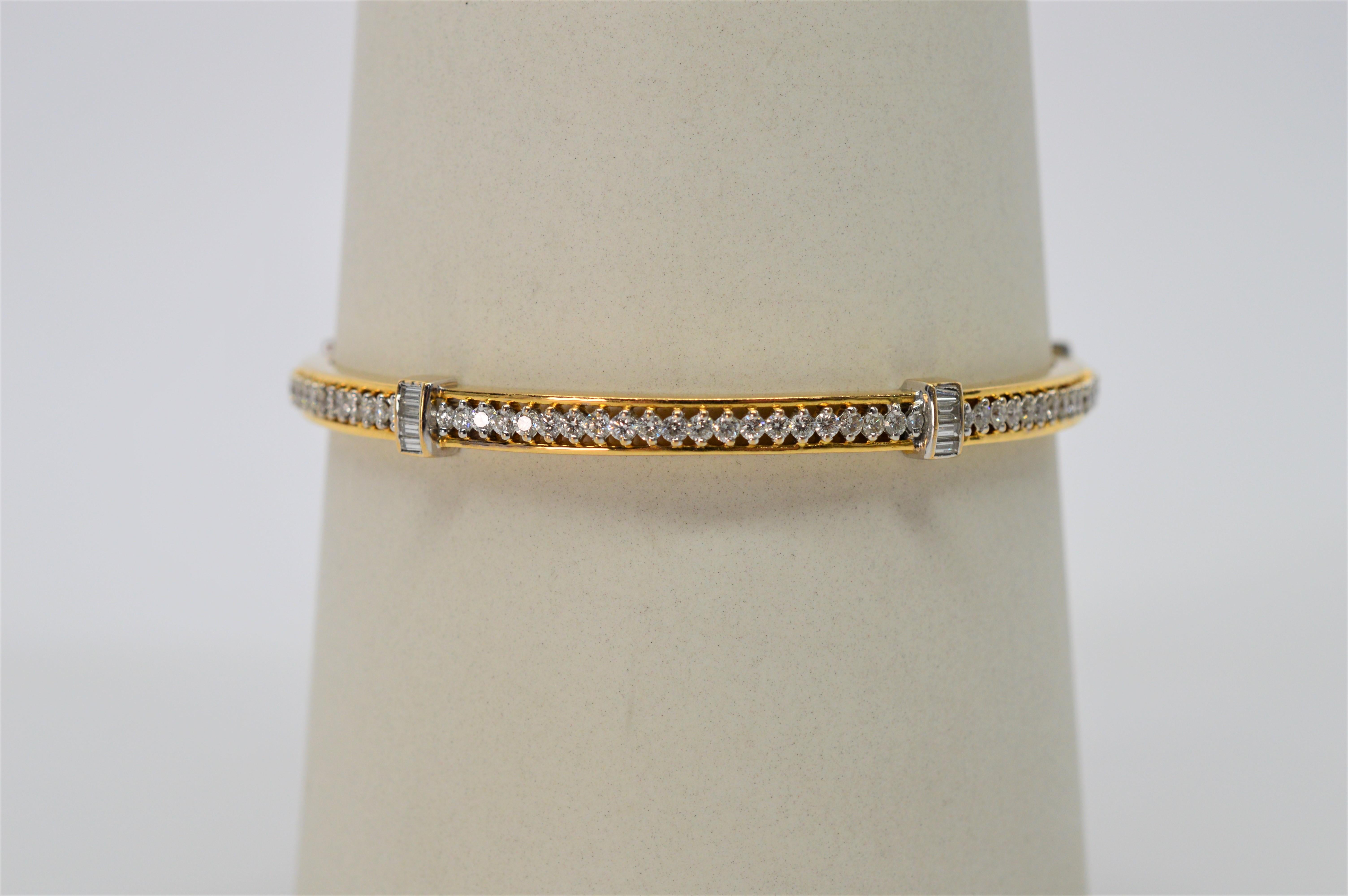 Over 3.5 carats of round H/VS diamonds encircle this 18 karat yellow gold bangle bracelet also featuring five mounted baguette-cut diamond stations. Handcrafted on the sub-continent of India and tastefully designed to wear alone or stacked with