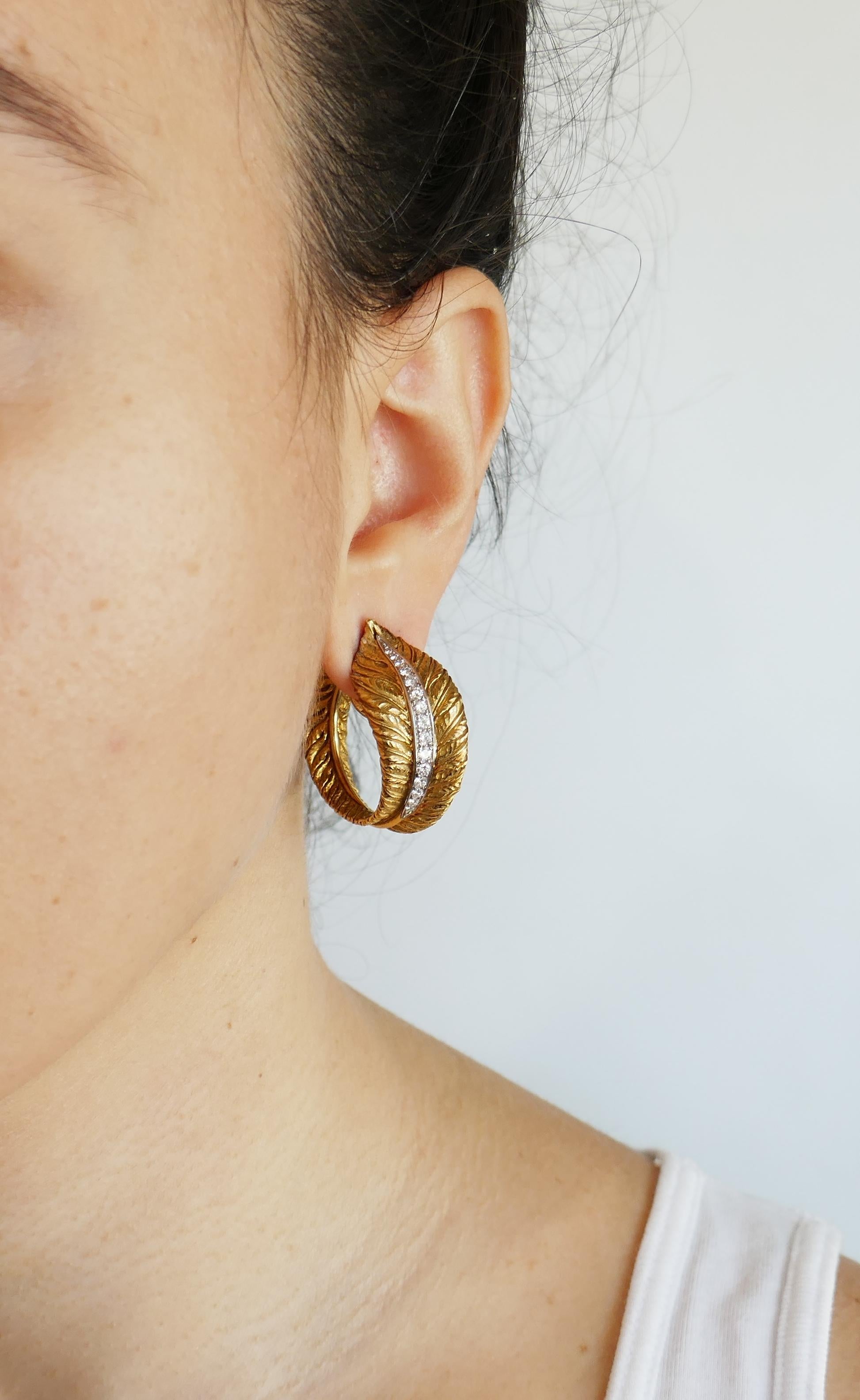 A pair of textured architectural hoop earrings. Elegant, timeless and wearable,  they are a great addition to your jewelry collection. 
The earrings are made of 18 karat (tested) yellow gold and set with round brilliant cut diamonds. Diamonds are