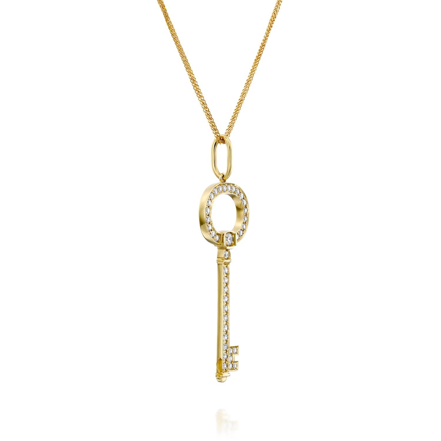 Indulge in the epitome of sophistication with our Diamond Yellow Gold Key Pendant. This exquisite piece effortlessly merges trendy design with timeless class, making it a true statement accessory. Adorned with 0.65 carats of dazzling F/VVS diamonds,