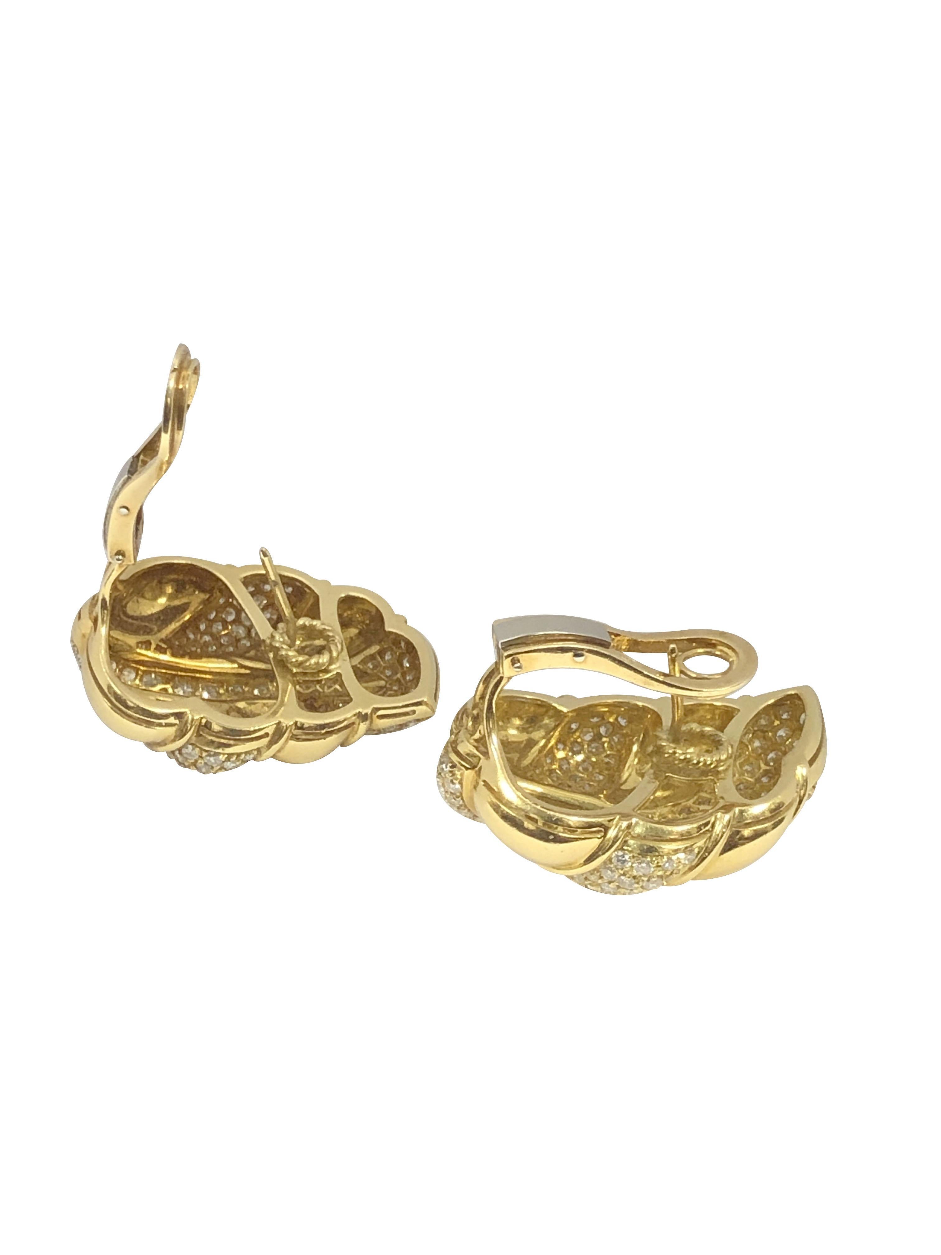 Circa 2000 18K Yellow Gold Leaf Form Earrings, Impressive and Large, measuring 1 1/4 inches in length X 1 inch wide and weighing 32.6 Grams. Set with Fine Round Brilliant cut Diamonds totaling 6 Carats and Grading as F-G in color and VS in Clarity. 