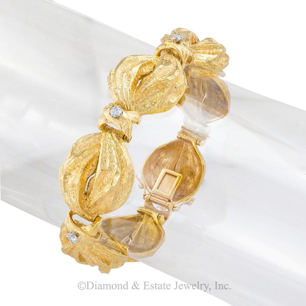 Vintage diamond and yellow gold puffed link bracelet circa 1960.  

SPECIFICATIONS:

DIAMONDS:  seven round brilliant-cut diamonds totaling approximately 0.50-carat, approximately G-H color, VS clarity.

METAL:  18-karat yellow gold.

WEIGHT:  64.7