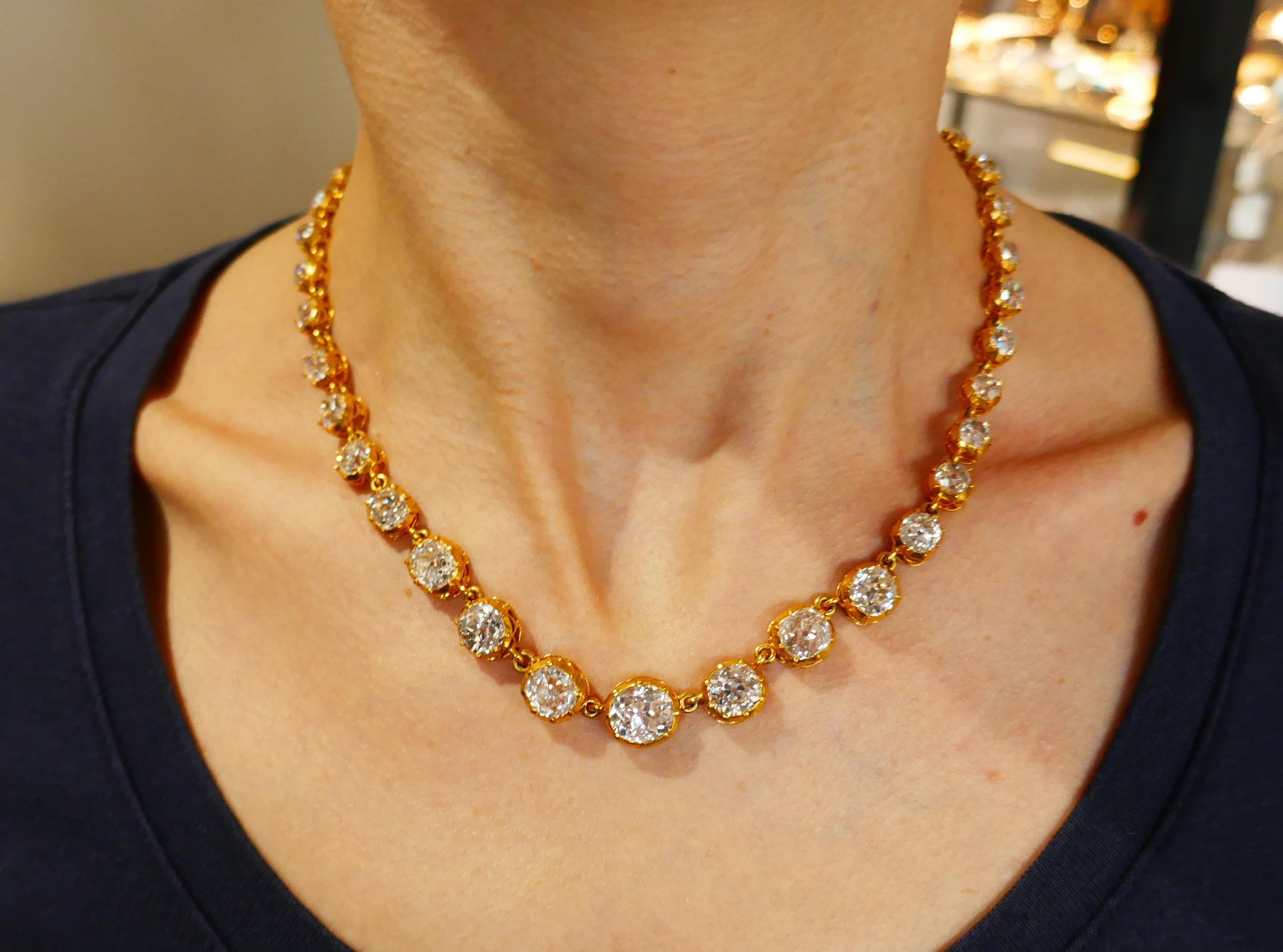 Stunning riviere necklace featuring thirty seven old mine cut diamonds set in yellow gold. Gold is tested as 18 karat. Diamond total weight is approximately 36 carats. The center diamond is approximately 3.50 carats, four diamonds are slightly under