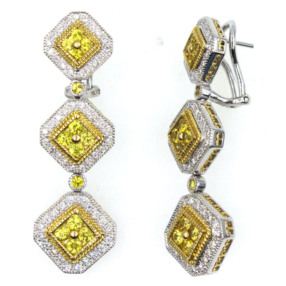 These magnificant drop earrings are crafted in 18 karat yellow and white gold. The three tier mobile drops measure 1.75 inches in length and .55 inches in width. The earrings feature 1.95 carat total weight of yellow sapphires, and .72 carat total
