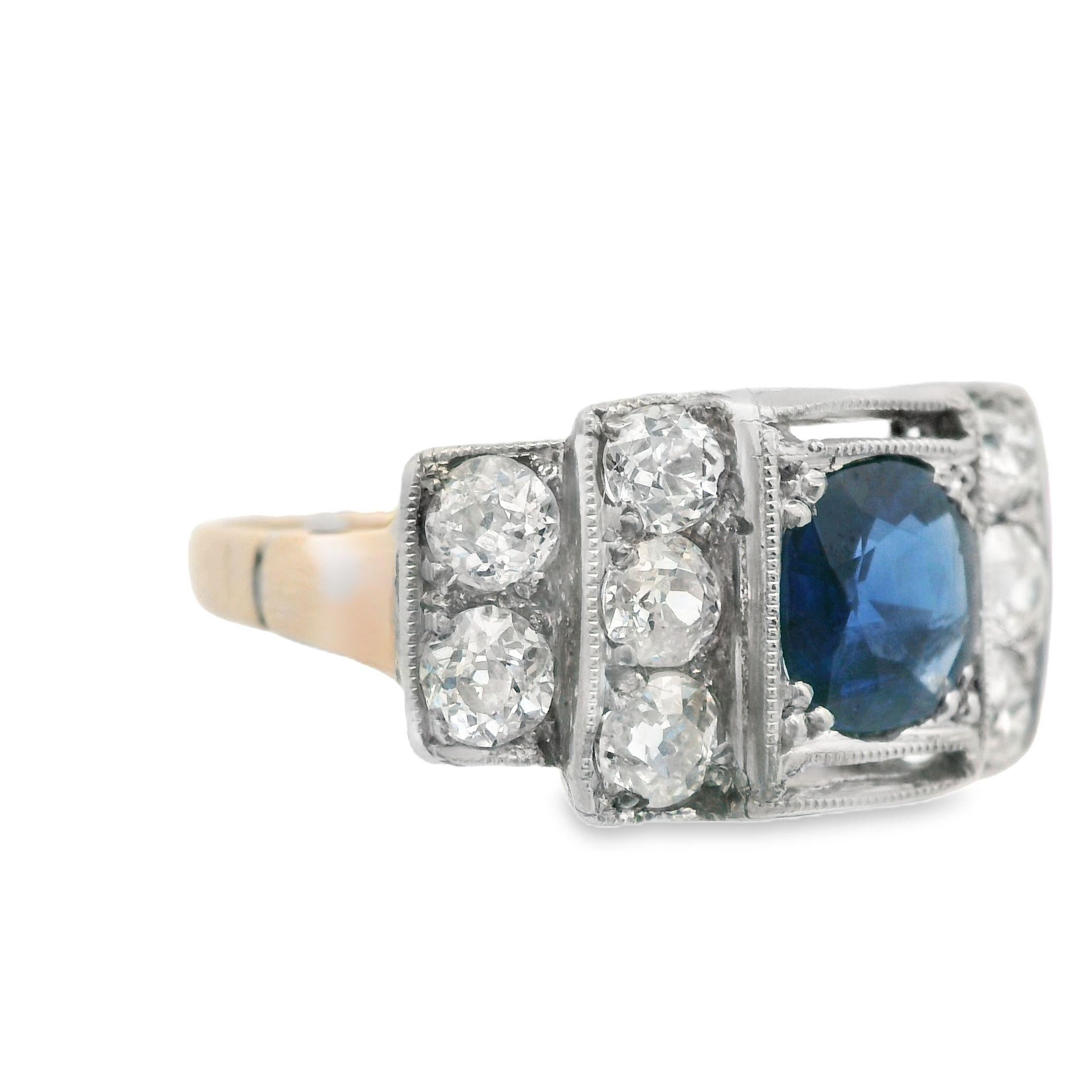 This gorgeous sapphire and diamond ring comes from the Edwardian era, and is made in both platinum and 14k yellow gold. The entire band of the ring is made in gold, and only the mounting for the diamonds and sapphire is in platinum. The center stone