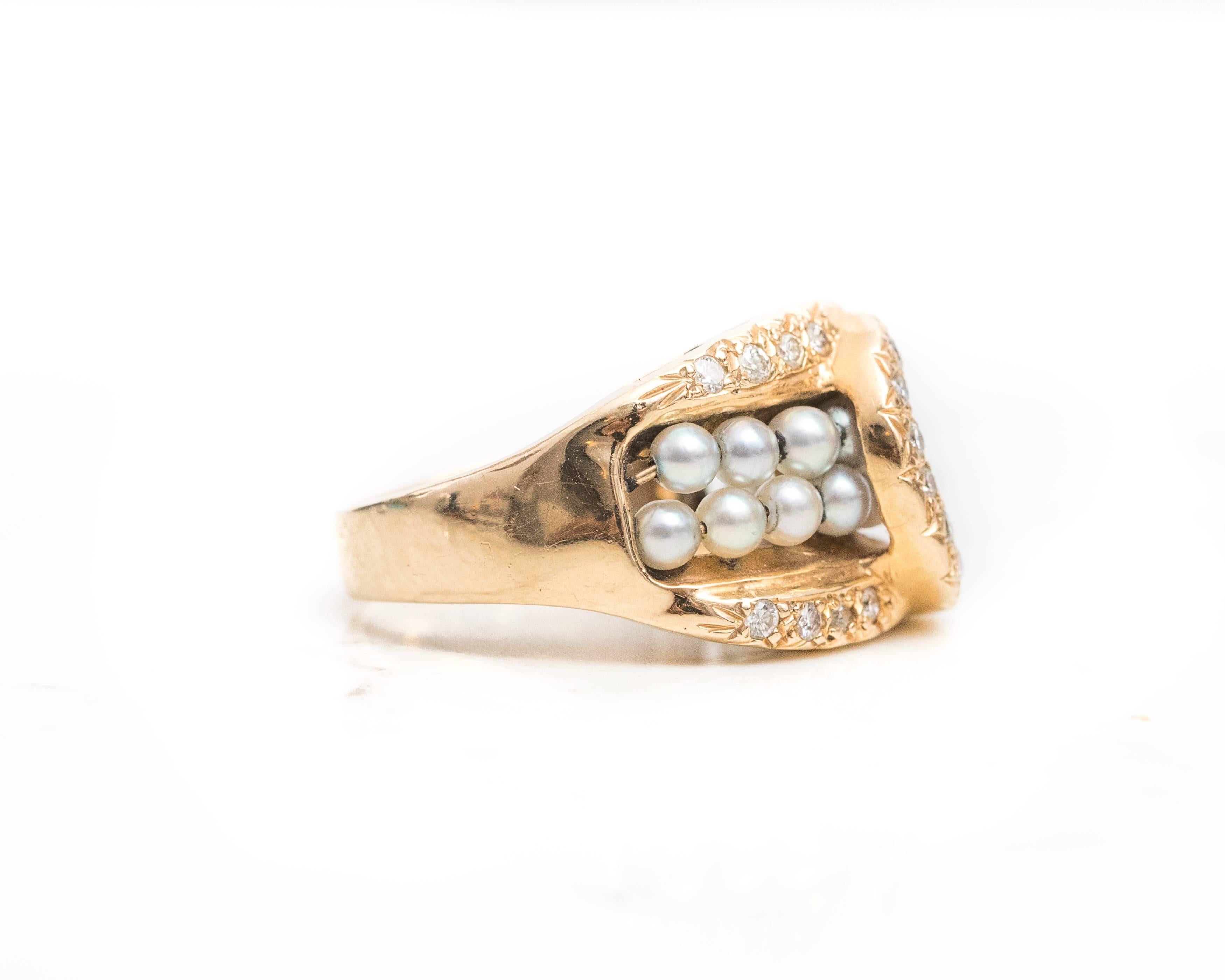 Belt Buckle Motif Ring - 14 Karat Yellow Gold, Silver Pearls, Diamonds

Features a crossover belt buckle design. Two rows of silvery grey round pearls are suspended horizontally along the ring front. They are bordered by a 14 Karat Yellow Gold frame