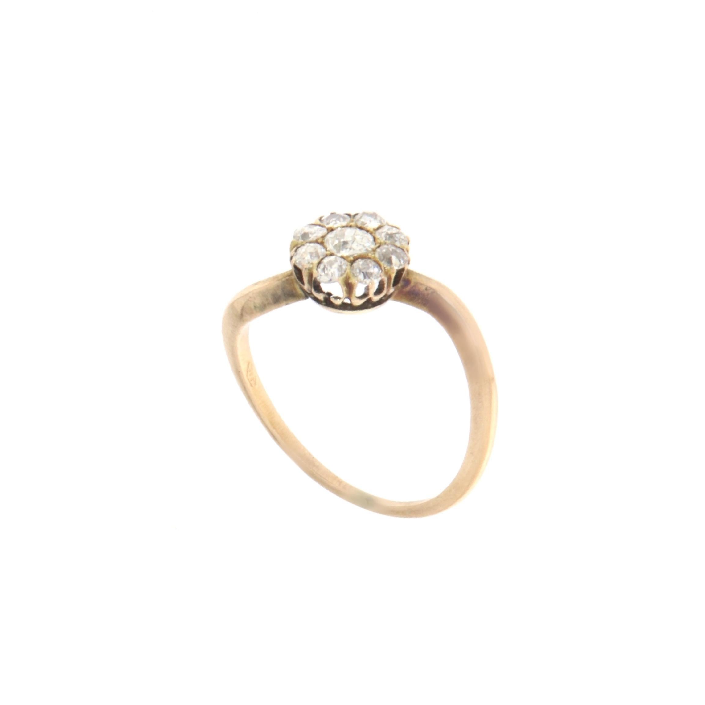 This enchanting ring is a treasure of simplicity and elegance, crafted in 14-karat yellow gold. It features a cluster of brilliant diamonds that come together to form a delicate floral motif, symbolizing everlasting beauty and grace. Each diamond is