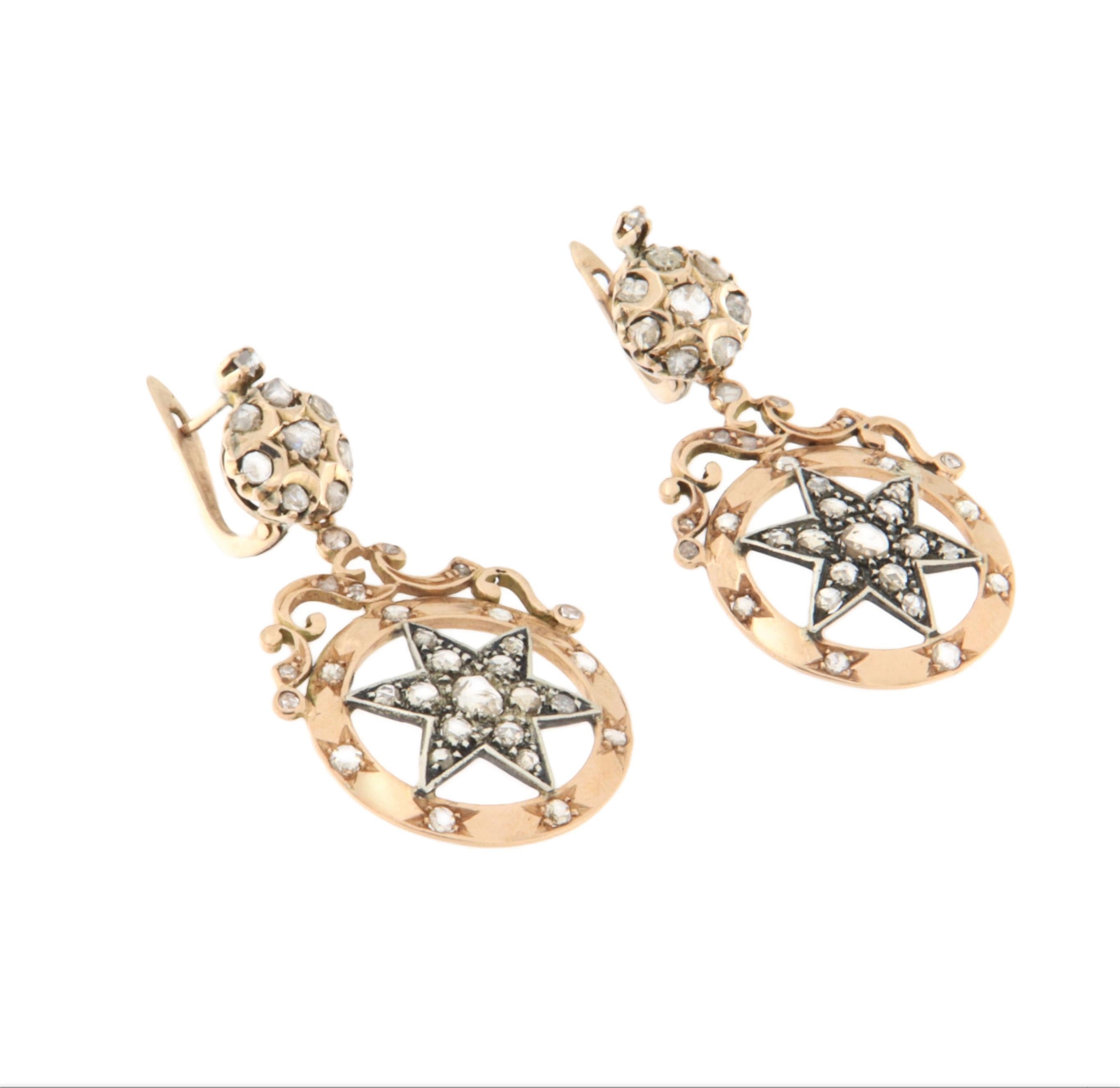 A tribute to timeless elegance and vintage allure, these stunning earrings are crafted in 14-karat yellow gold and adorned with sparkling rose-cut diamonds, masterfully set by hand. The refined design draws inspiration from celestial motifs: a