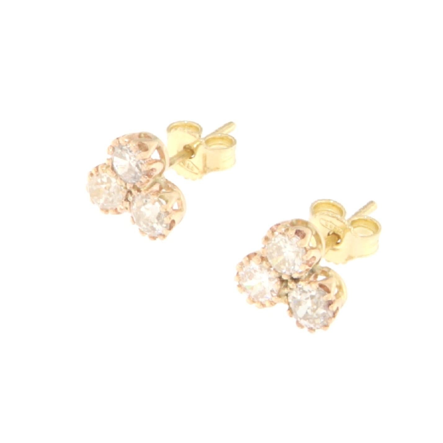 These elegant earrings are crafted from 14-karat yellow gold and feature a cluster of sparkling brilliant-cut diamonds. Each earring is designed to capture and reflect light, providing a dazzling display that is perfect for any occasion, from