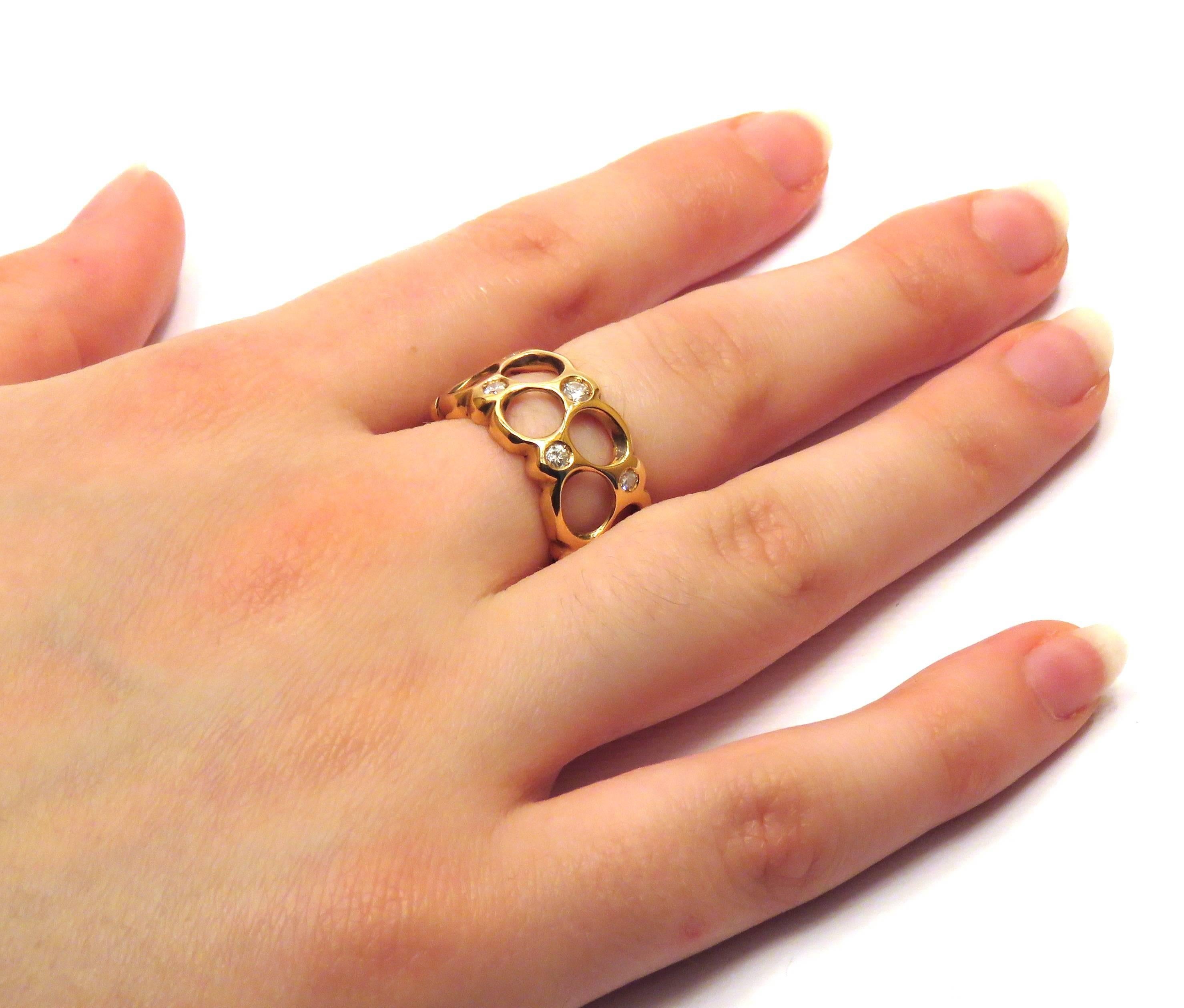 An 18 kt rose gold ring made by big and little soap bubbles that form a band with diamonds.
Dimensions:	22x12 mm - 0,866142x0,472441 inches
Diamonds: 0,55 ctw color F clarity VS1 
Us size: 5 3/4 - Italian size: 11 - French size: 51
It  is stamped