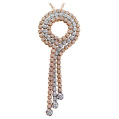 Collier pendentif en or rose et or blanc 18 carats et diamants