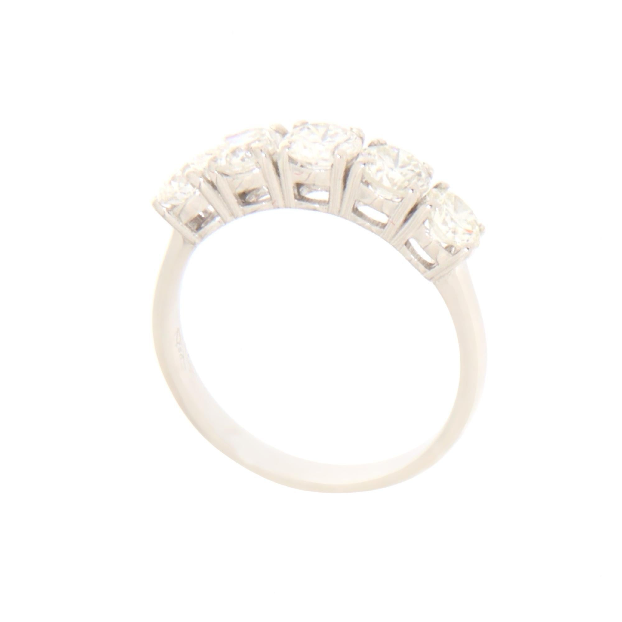 This 18-karat white gold ring is an expression of timeless elegance and understated luxury. Designed to capture both light and attention, this piece is embellished with five brilliant diamonds, each meticulously chosen for its exceptional clarity