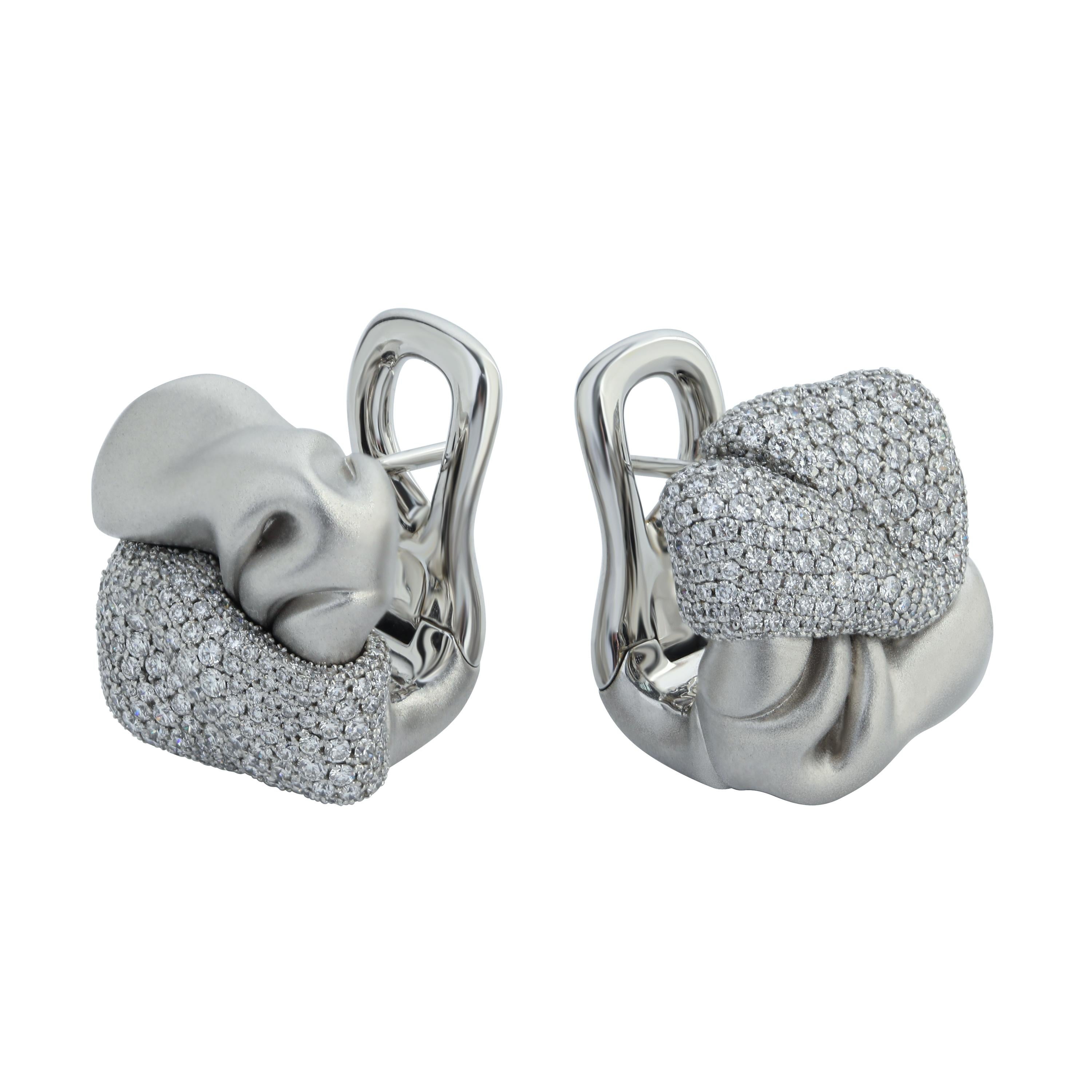 Diamonds 18 Karat White Gold Earrings
OurPret-a-Porter collection is full of different textures and patterns. This time we decided to depict just a piece of crumpled fabric in the Earrings. Half of the Earring is made of 18 Karat Matte White Gold,