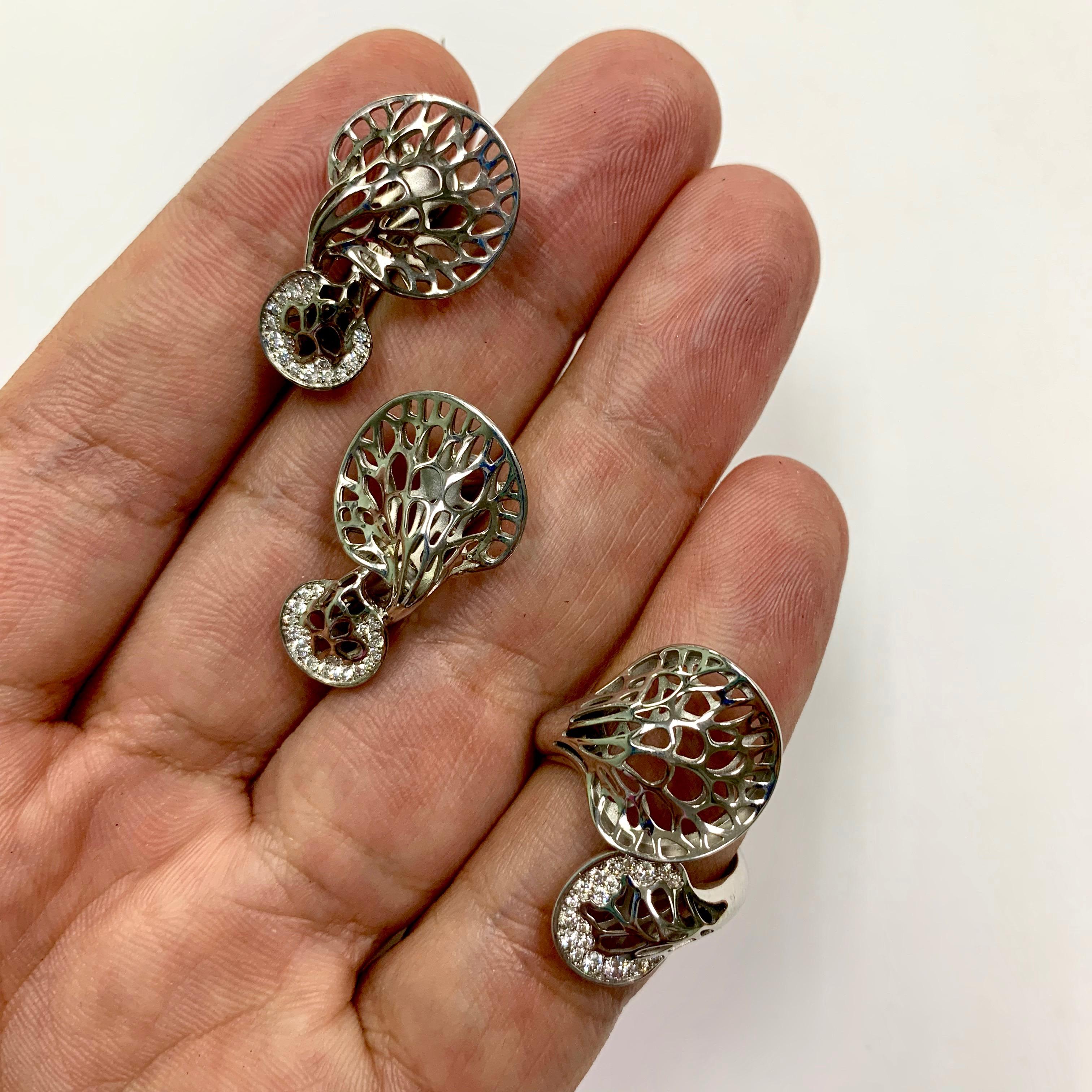 Diamonds 18 Karat White Gold Tree Mushroom Ring Earrings Suite
We present to your attention a Suite from our Tresure Forest Collection in the form of a tree mushroom. White 18 Karat Gold Suite has an abnormal deeply cracked shape which was created,
