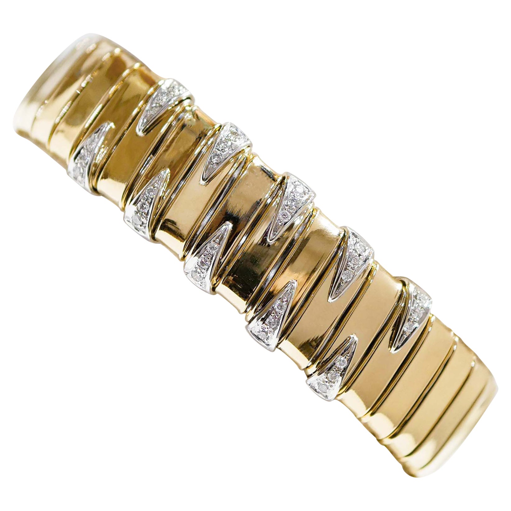 Tubogas-Armband aus Diamanten, 18 Karat Gelbgold und Weißgold.