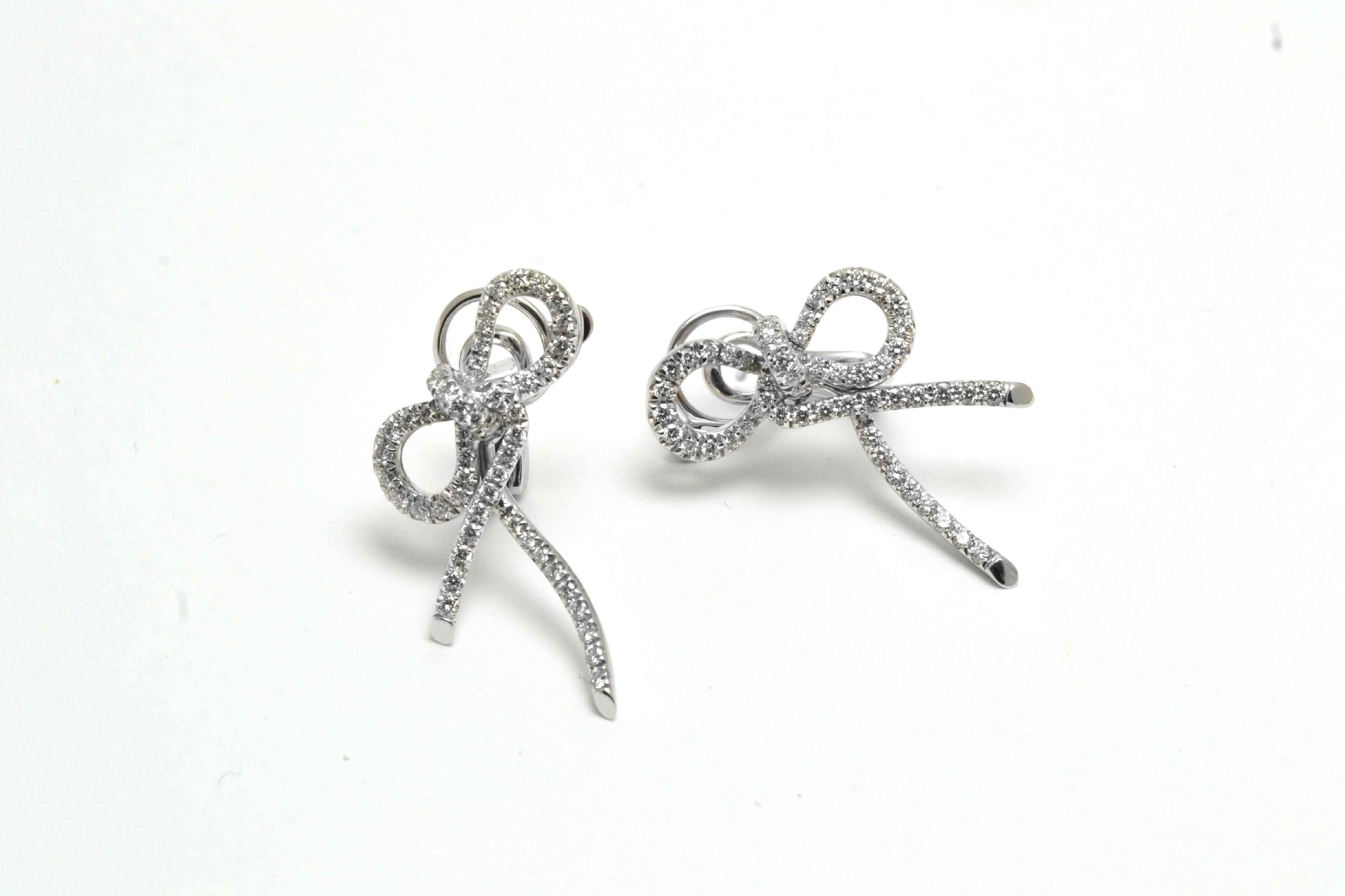 Enchanting Bow earrings, handmade in 18 Kt white gold, in our family workshop in Italy.
the are very carefully set with diamonda of best quality.
A  system at the back allows to add drops to the top of the earrings.
Please ask us for more